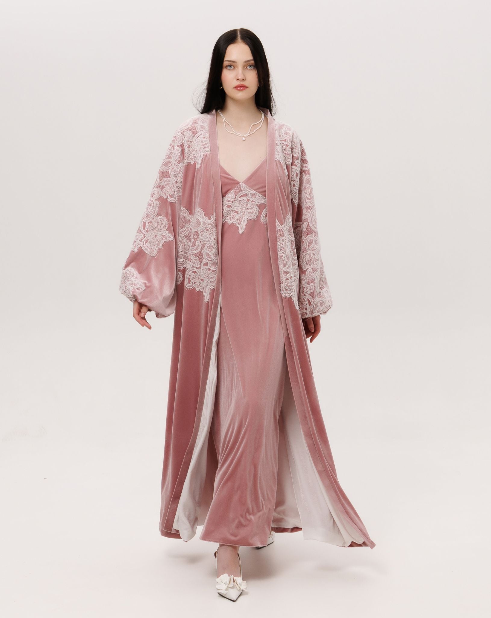 A dynamic view of the flowing silhouette, showcasing how the velvet drapes beautifully during movement.