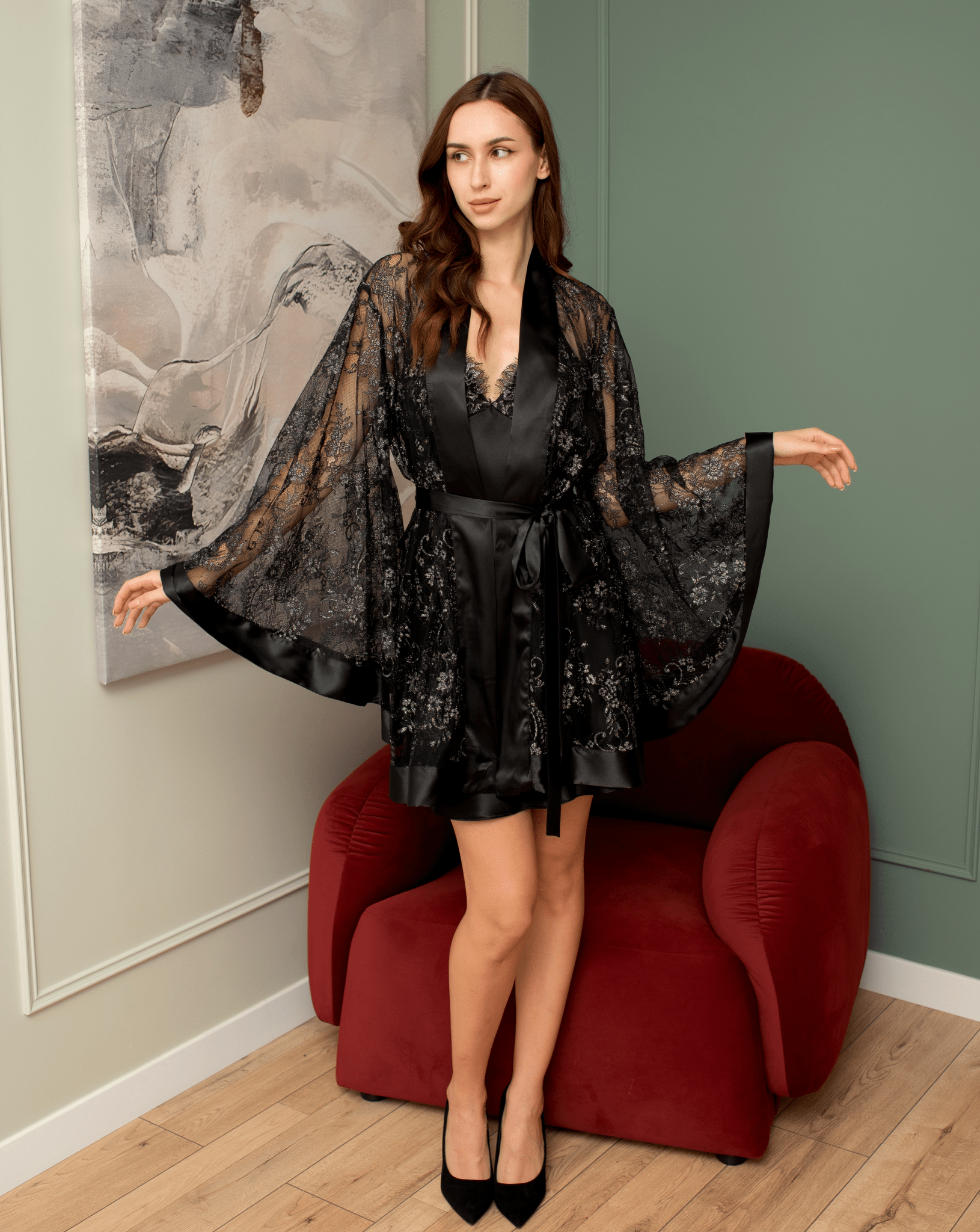 Full-length black floral lace robe layered over a matching slip.