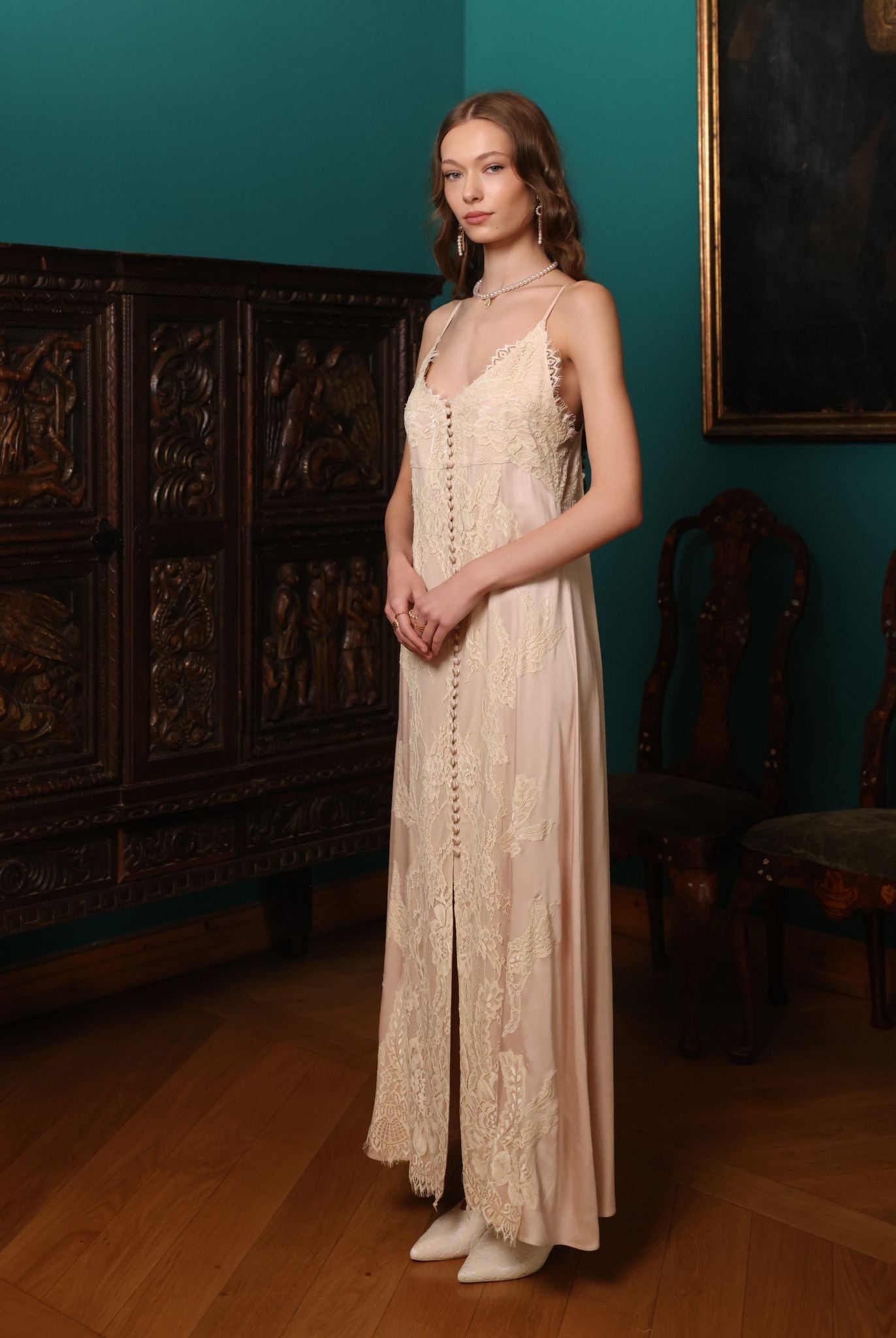 Side perspective of the nightdress, illustrating the soft, luminous texture and the flattering, airy shape.