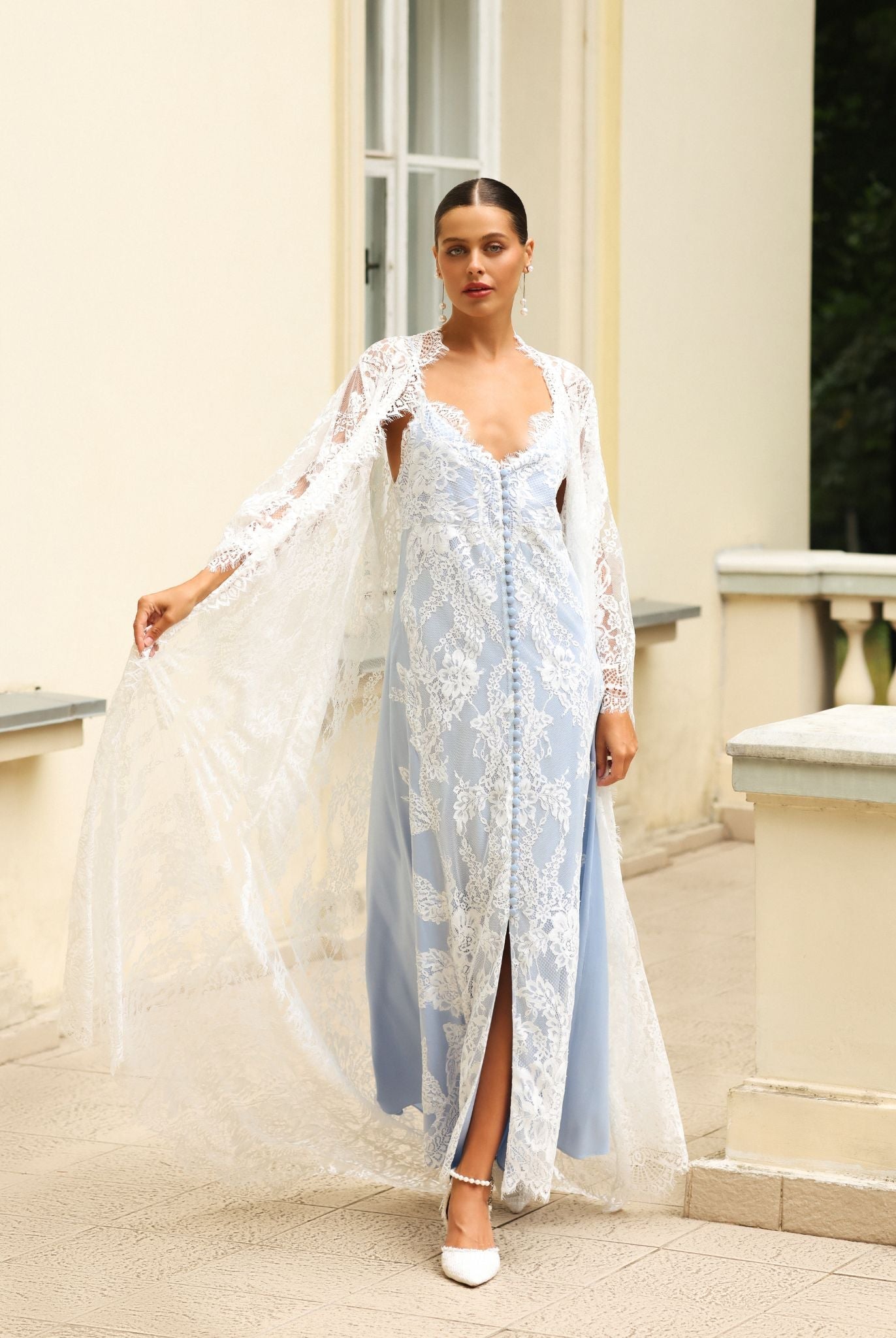 Elegant embroidered robe worn over a long lace gown, Kafemme design captured outdoors