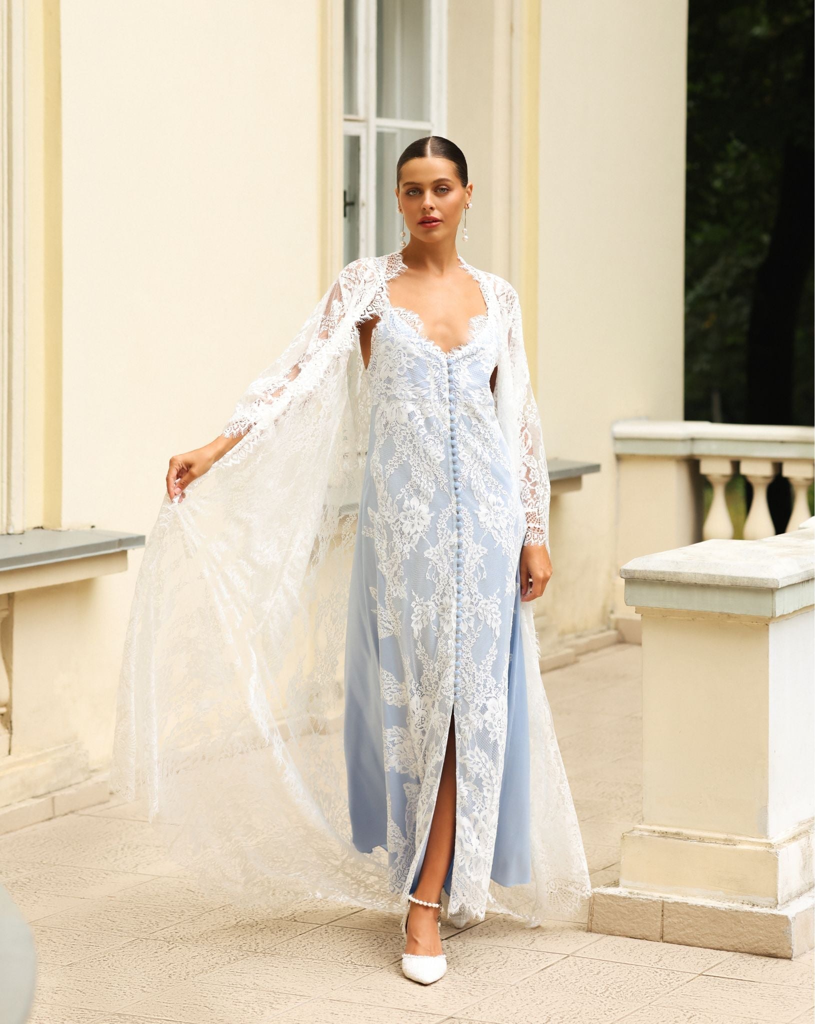 Elegant embroidered robe worn over a long lace gown, Kafemme design captured outdoors