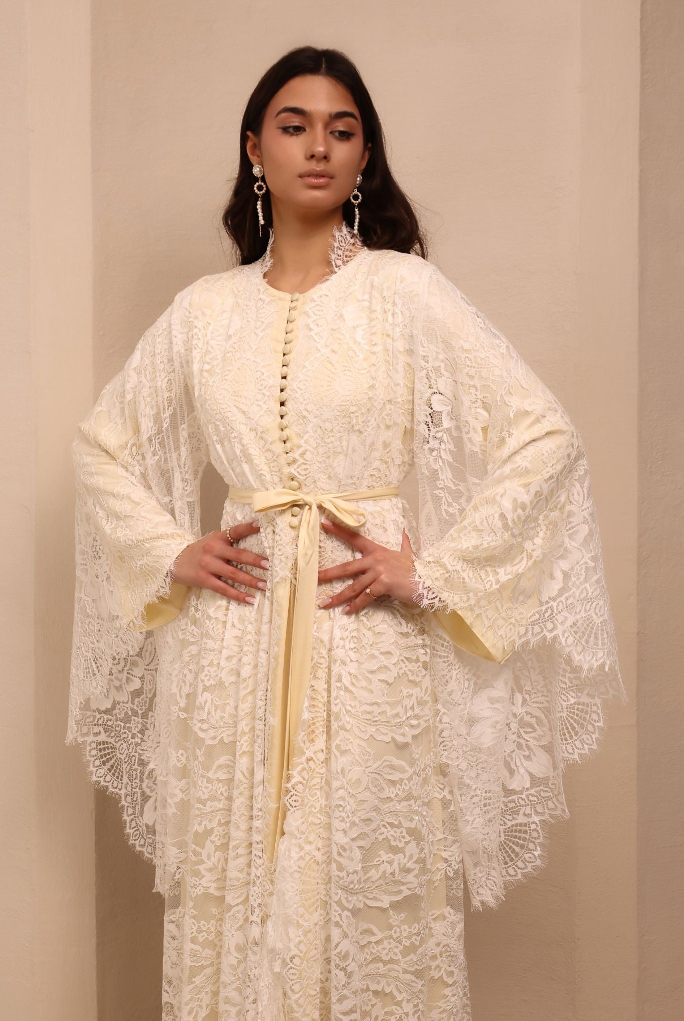A mid-length shot of the attire, capturing the poetic movement and timeless detail of the lightweight fabric.