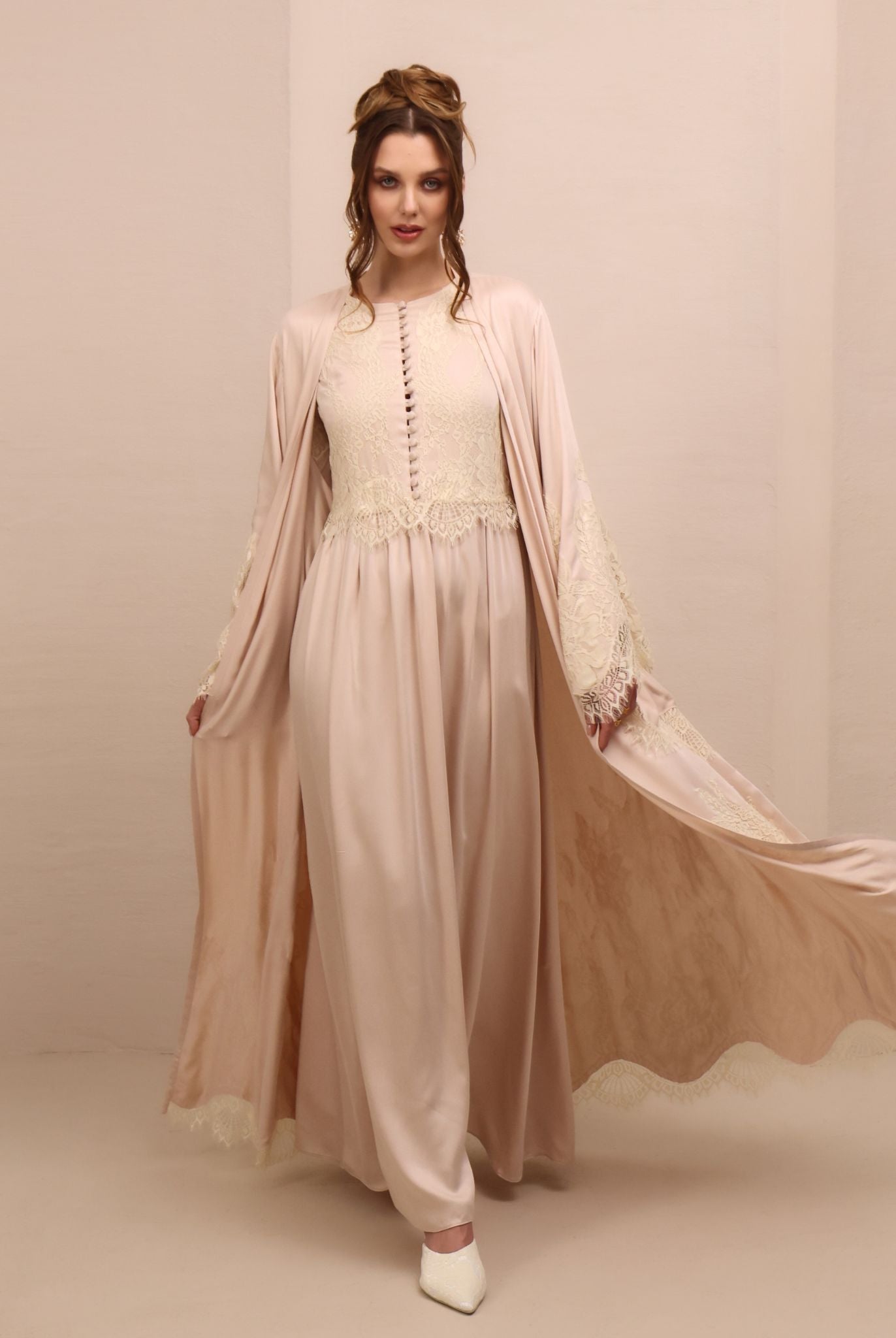 A dynamic motion shot of the Robe and Nightgown Set, capturing the floor-length cut and airy movement.