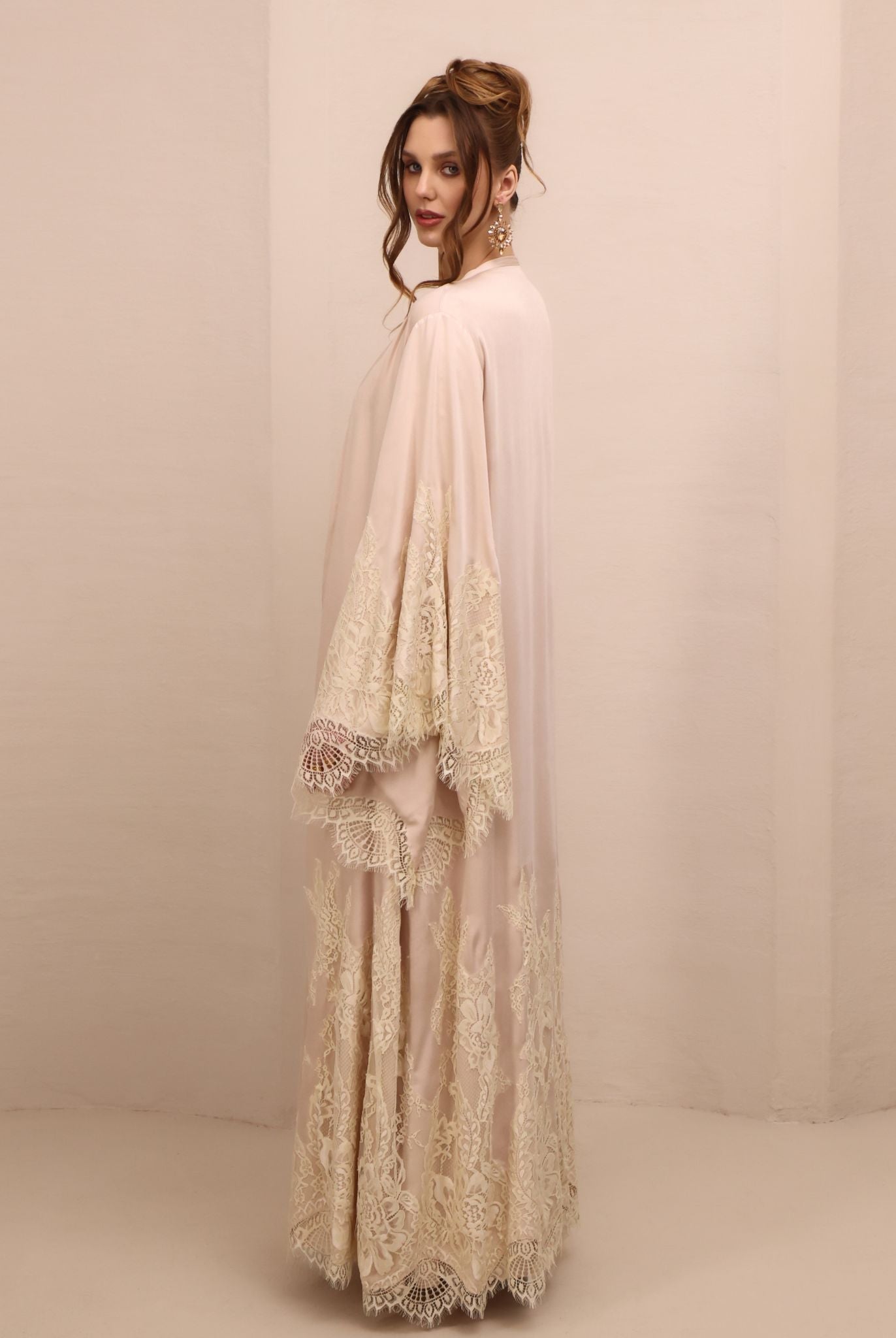 Side perspective of the open ensemble, showcasing the wide sleeves decorated with soft floral French lace.