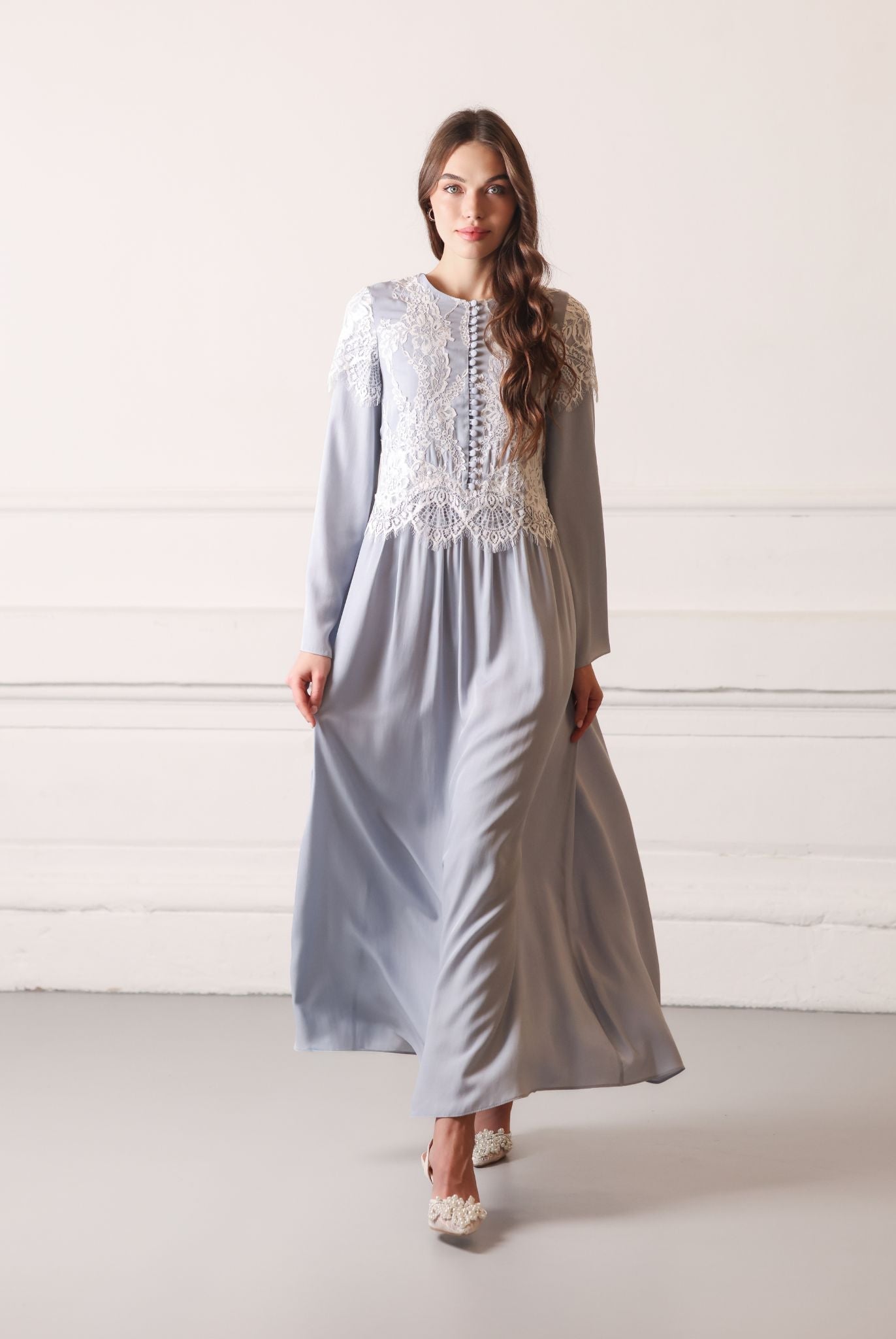 Graceful walk in a viscose nightgown, featuring delicate lace embroidery and a feminine, relaxed look.