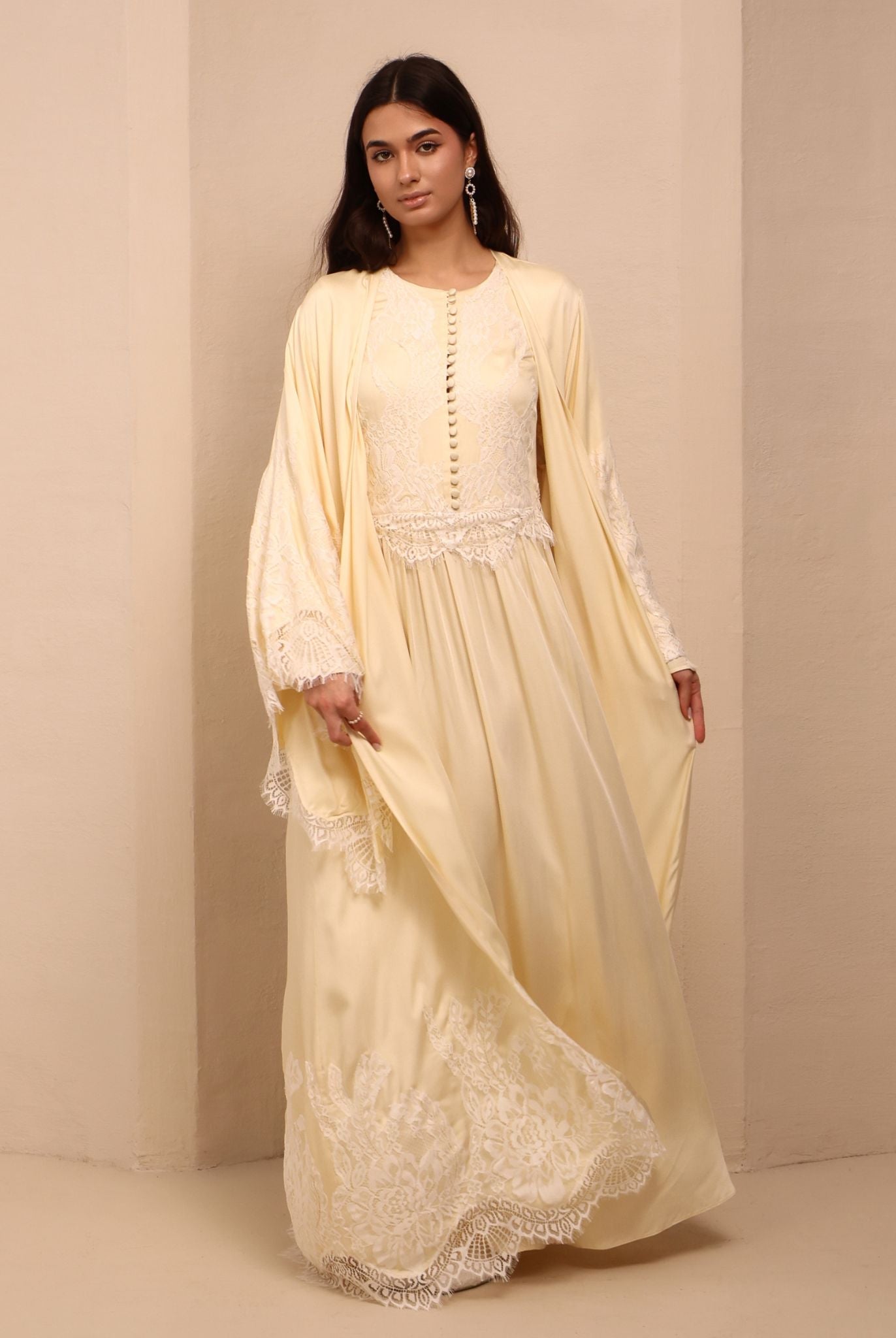 A dynamic view of the Robe and Nightgown Set in motion, highlighting the floor-length cut and wide sleeves.