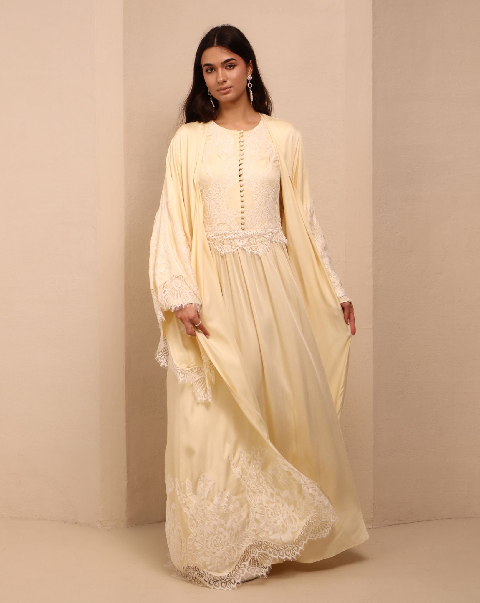 A dynamic view of the Robe and Nightgown Set in motion, highlighting the floor-length cut and wide sleeves.