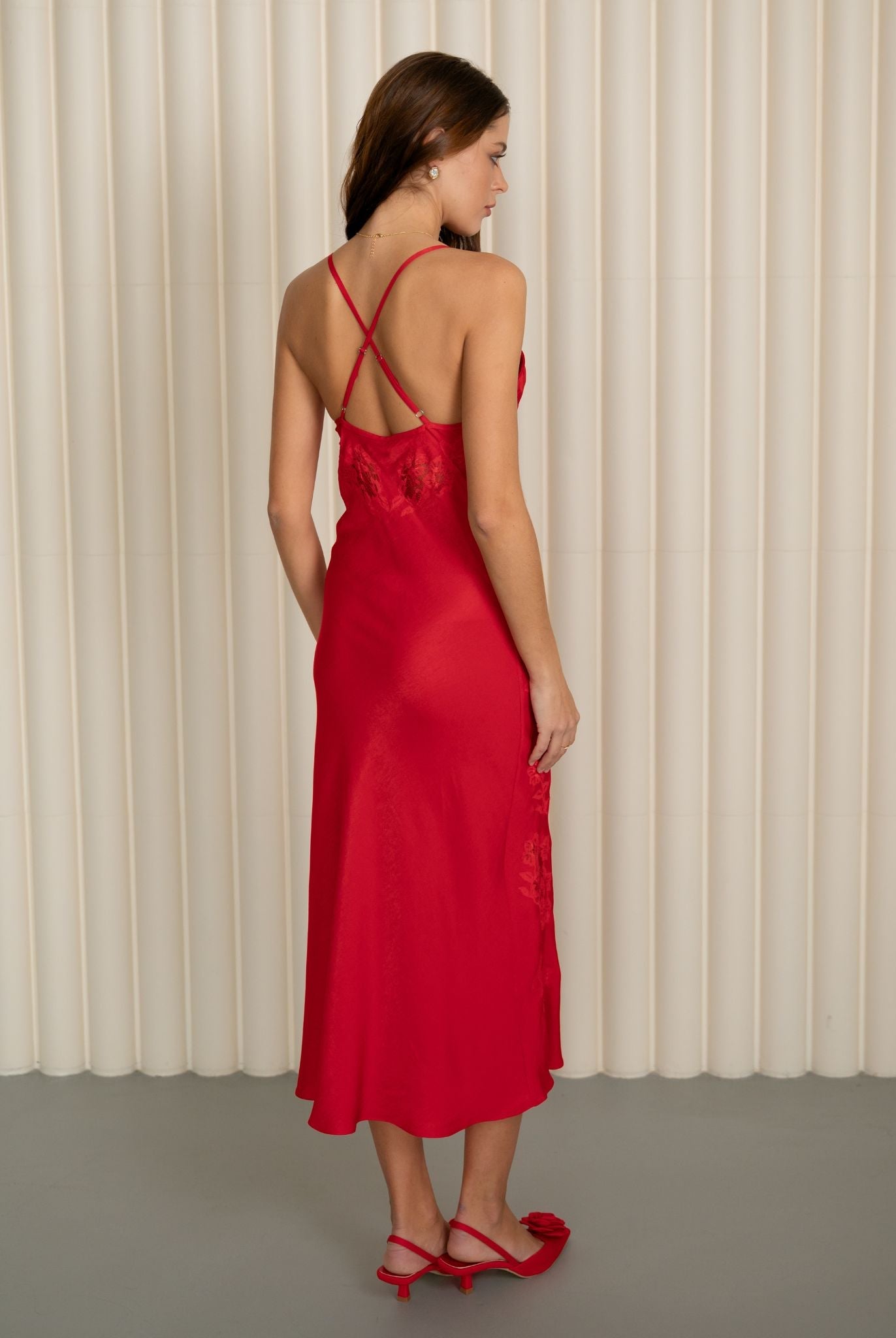 Rear full-length view of the red viscose nightgown, emphasizing the effortless elegance and smooth texture.