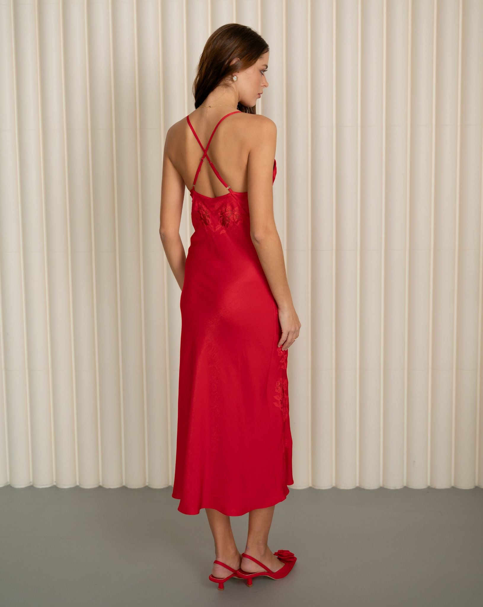 Rear full-length view of the red viscose nightgown, emphasizing the effortless elegance and smooth texture.