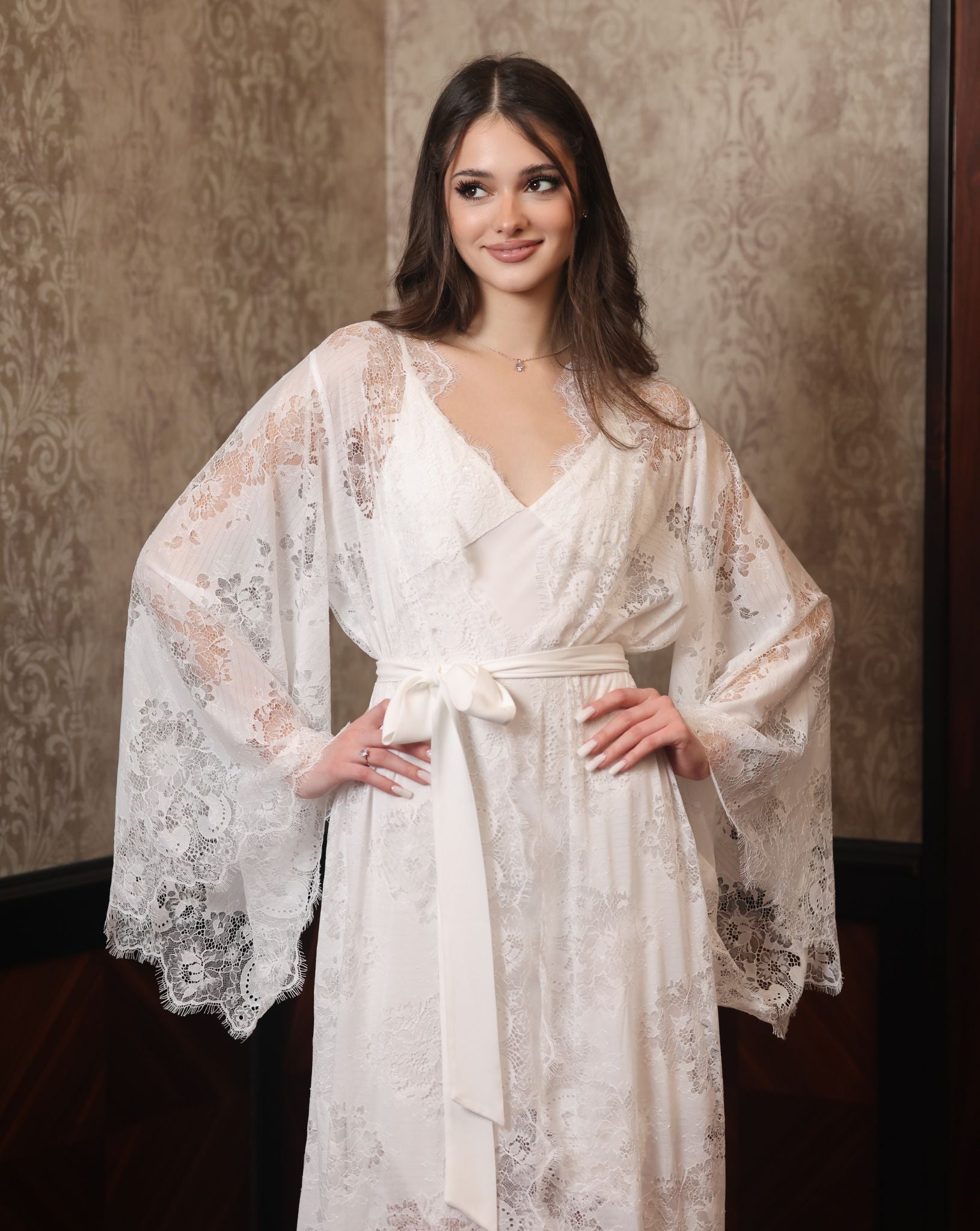 Mid-length shot focusing on the lace texture of the sleeves and the perfect balance of comfort and grace.