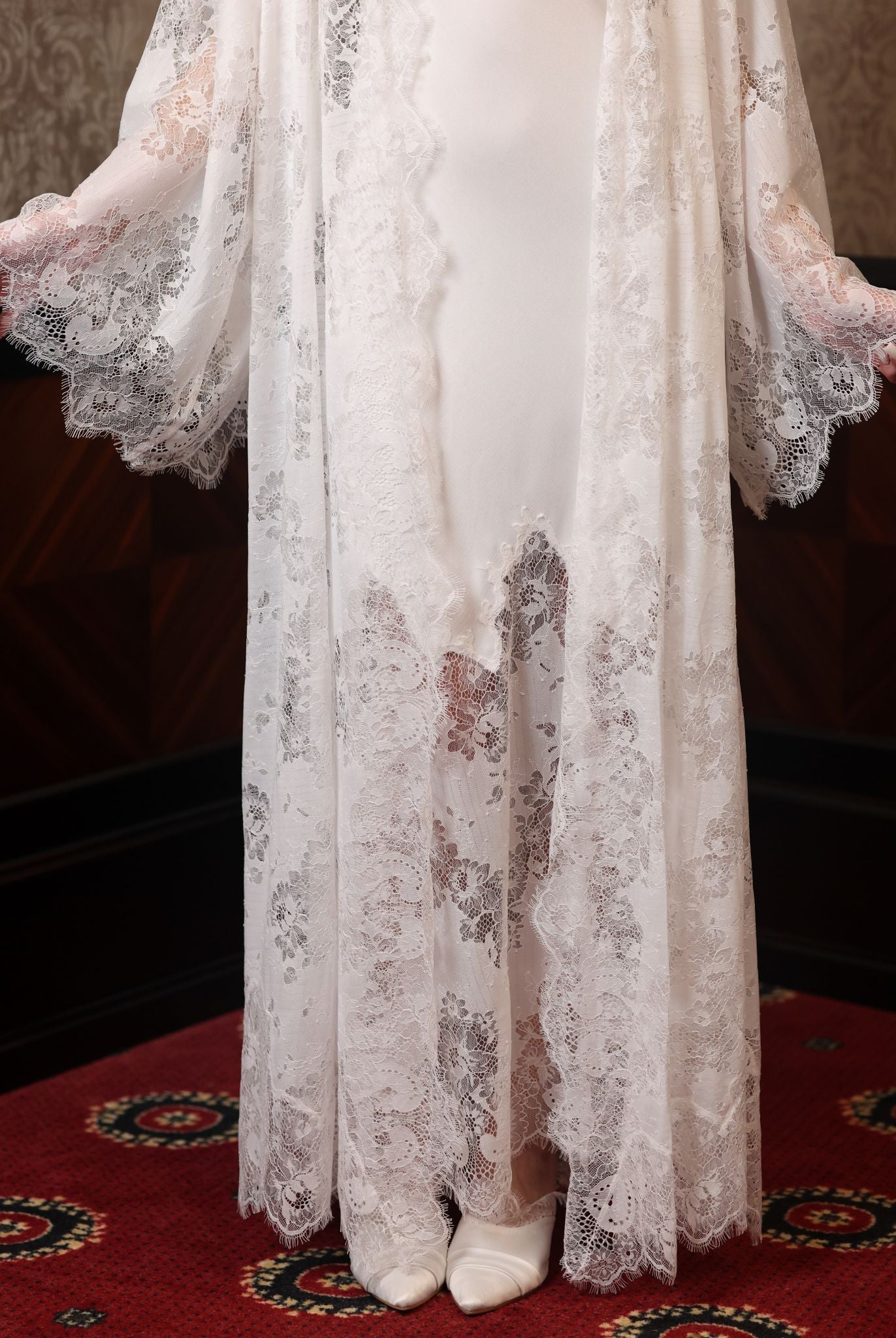 Detailed view of the lower part of the layered set, illustrating the soft movement of the lace and cotton.