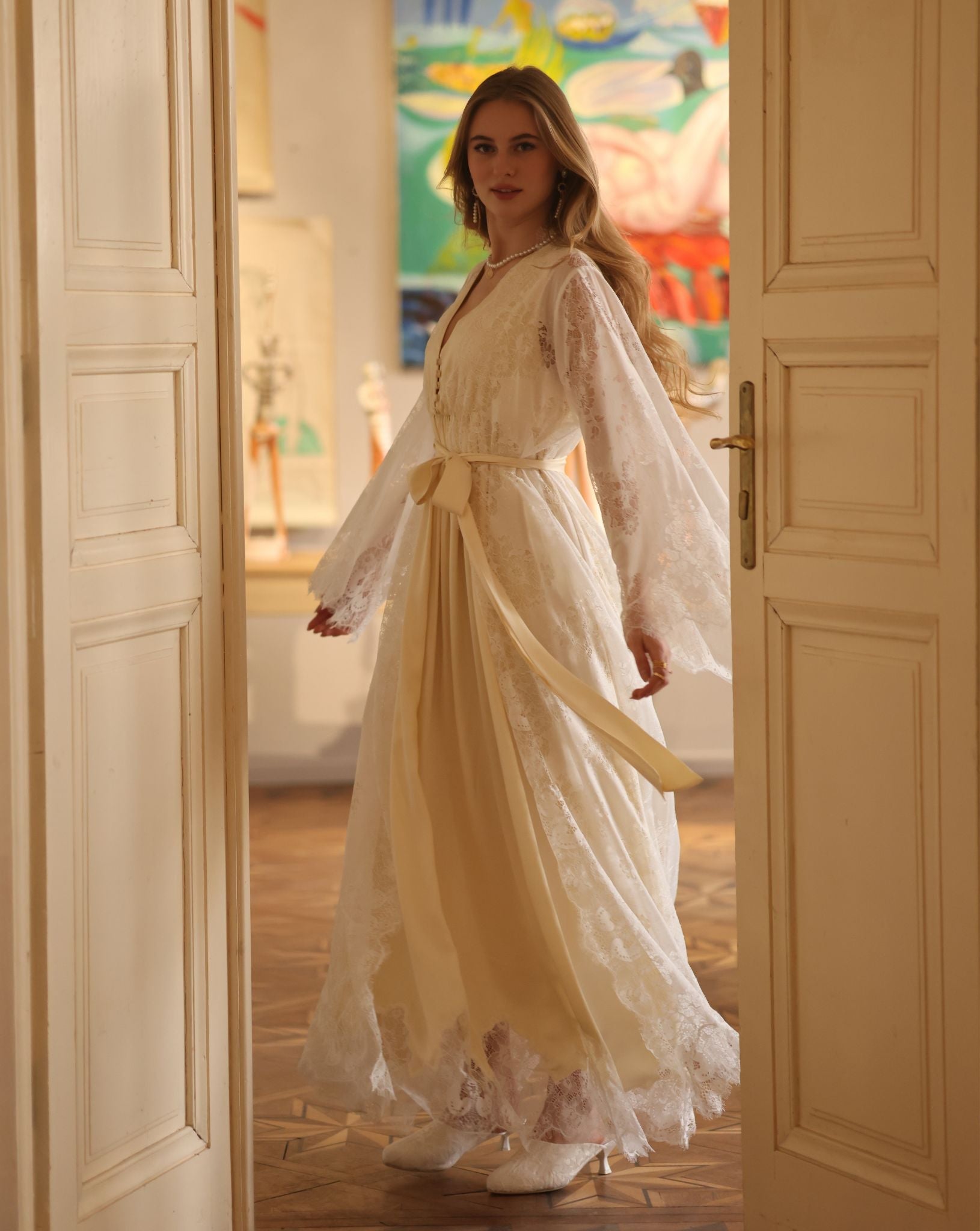 A dynamic turn in the Robe and Nightgown Set, capturing the movement of delicate lace and flowing fabric.