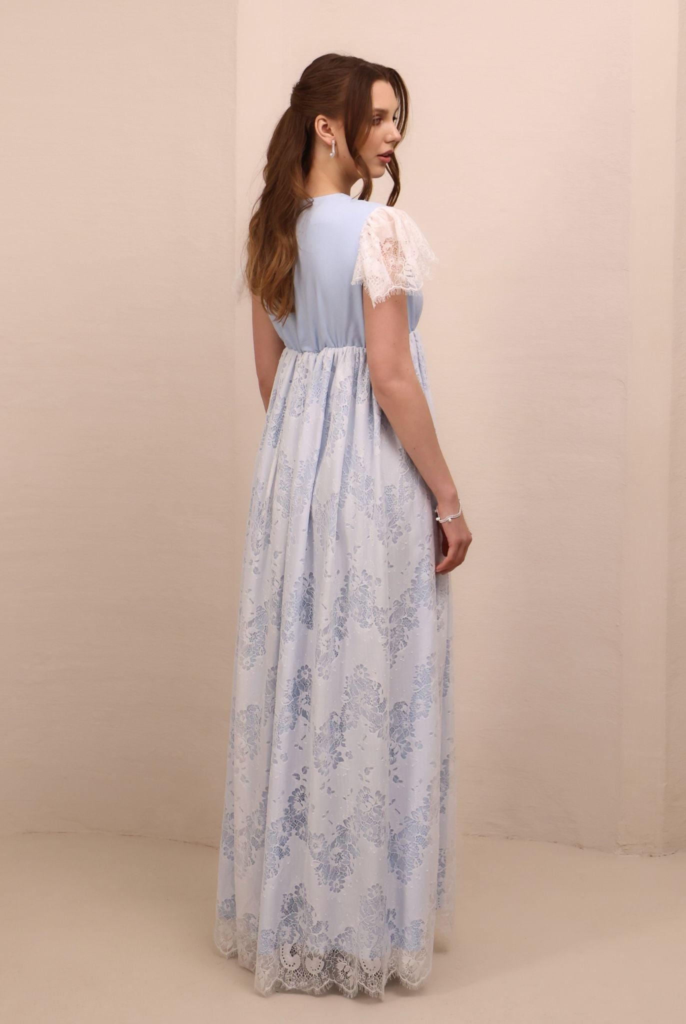 Rear view of the slip dress, illustrating the breathable fit and the graceful drape of the cotton-viscose blend.