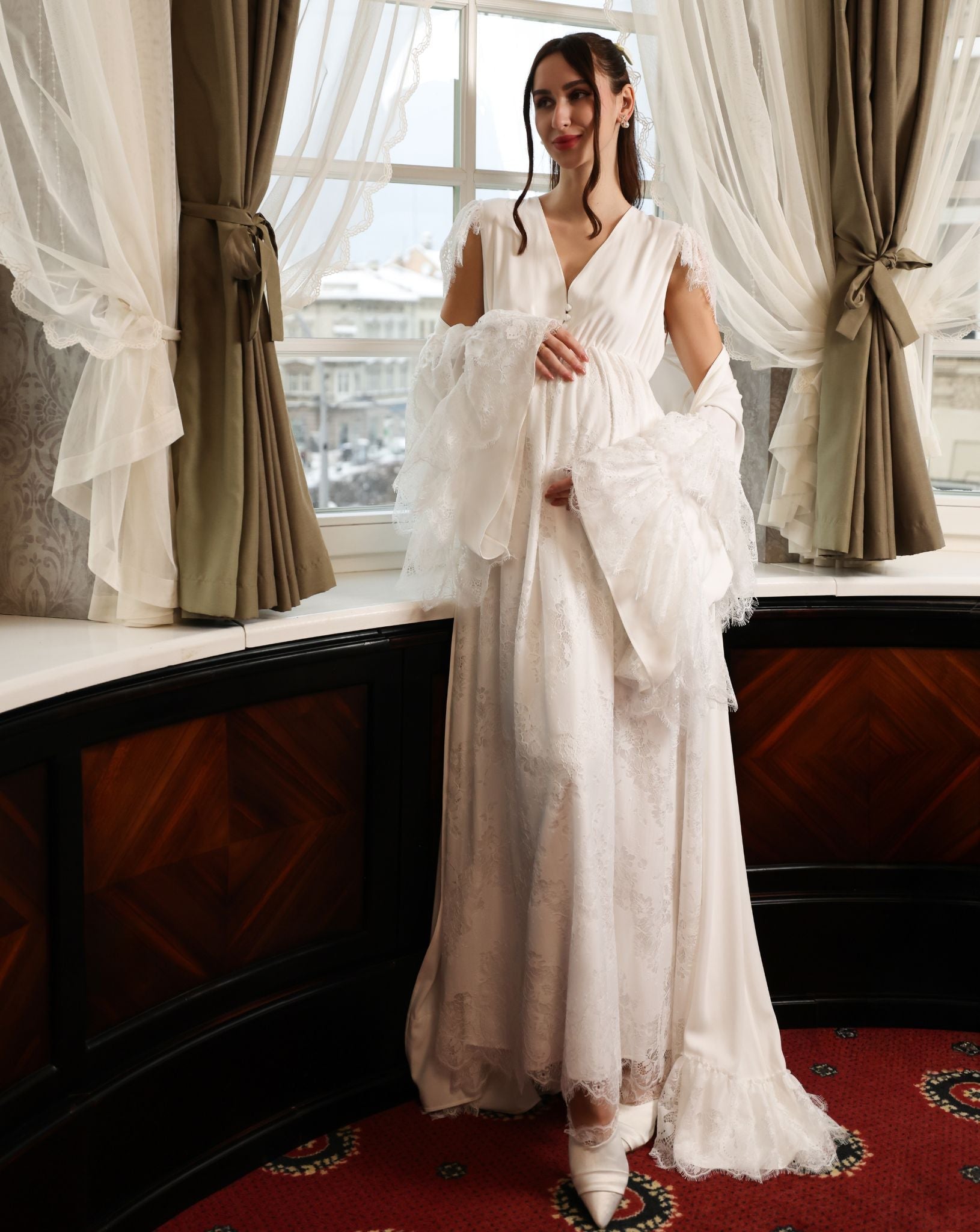 A poetic shot of the Cotton Robe and Nightgown Set by the window, capturing a moment of quiet grandeur.