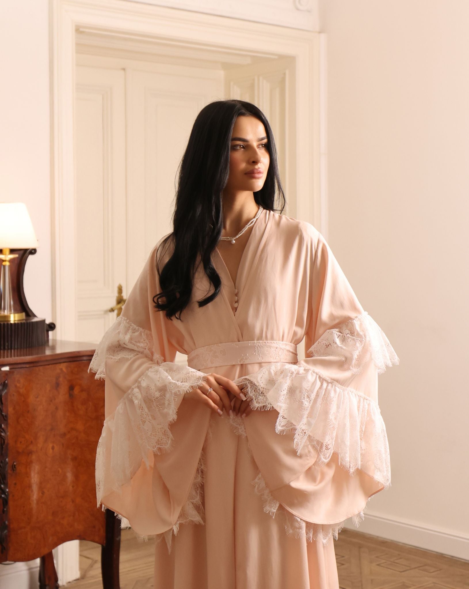 An atmospheric maternity shot focusing on the natural refinement and soft textures of the cotton-viscose blend.