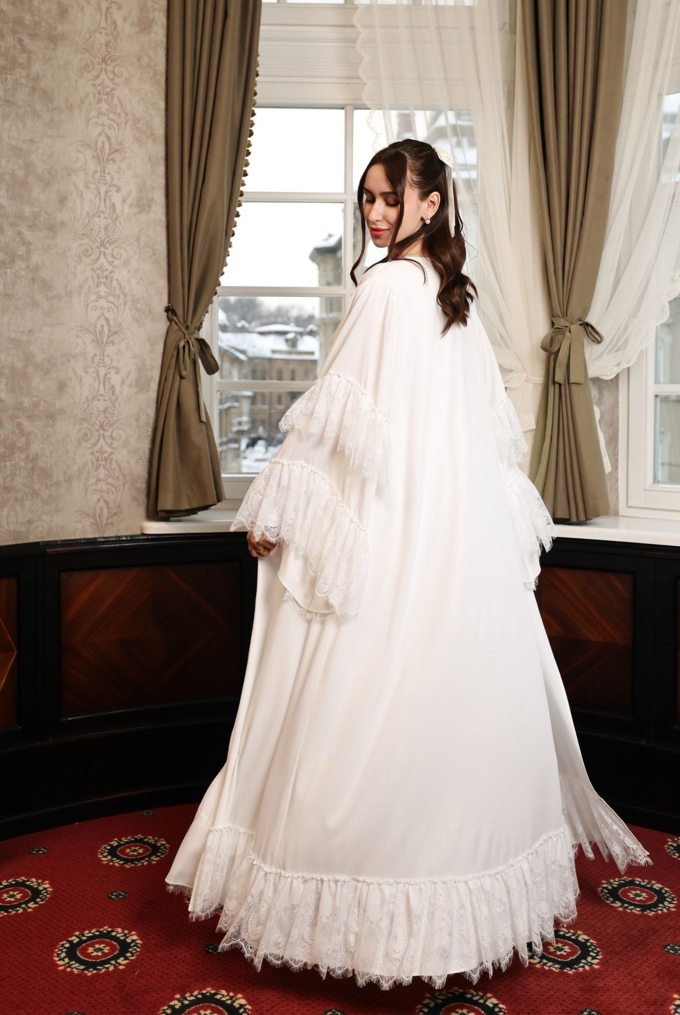 Back view of the floor-length ensemble, showcasing the ethereal finish and the natural flow of the cotton fabric.