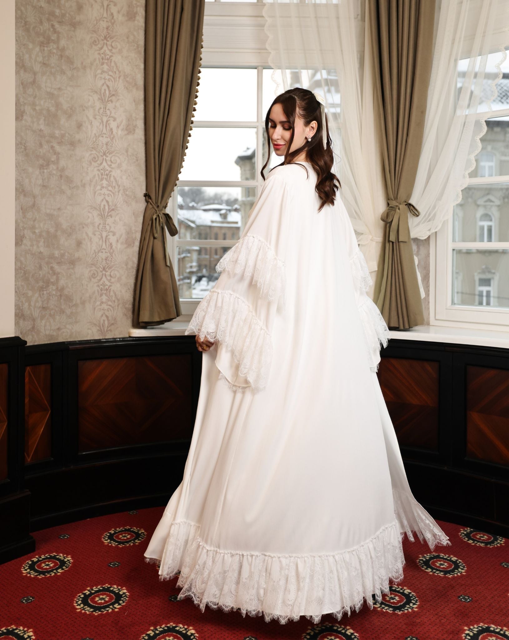 Back view of the floor-length ensemble, showcasing the ethereal finish and the natural flow of the cotton fabric.