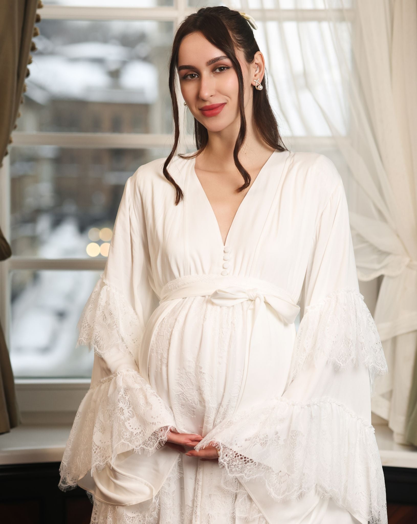 Close-up of the maternity-friendly top, featuring buttons along the neckline for discreet breastfeeding access.