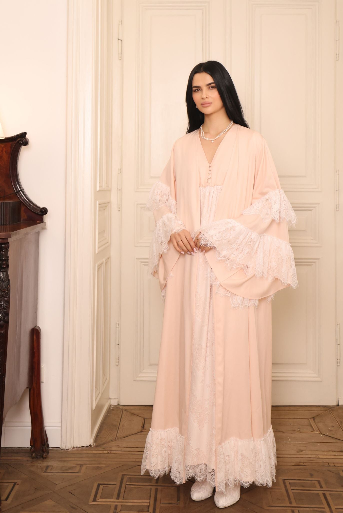 Side view of the complete set, showcasing how the gathered waist and lace edging move beautifully with the body.