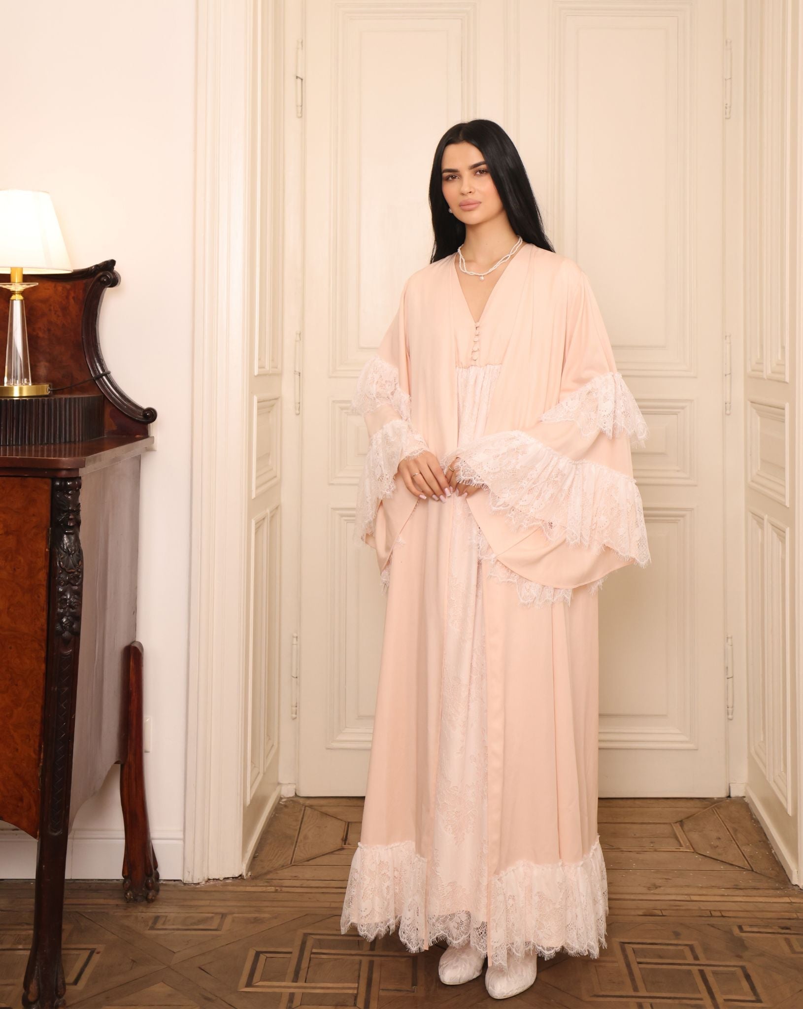 Side view of the complete set, showcasing how the gathered waist and lace edging move beautifully with the body.