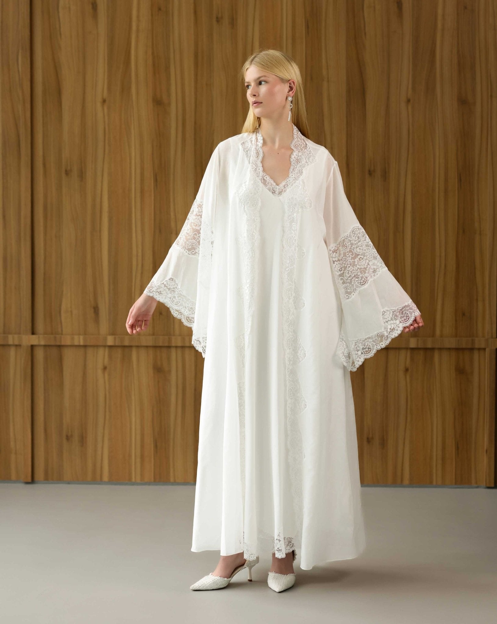 White maternity robe with expansive lace-trimmed sleeves, shown in a front view to highlight the airy silhouette.
