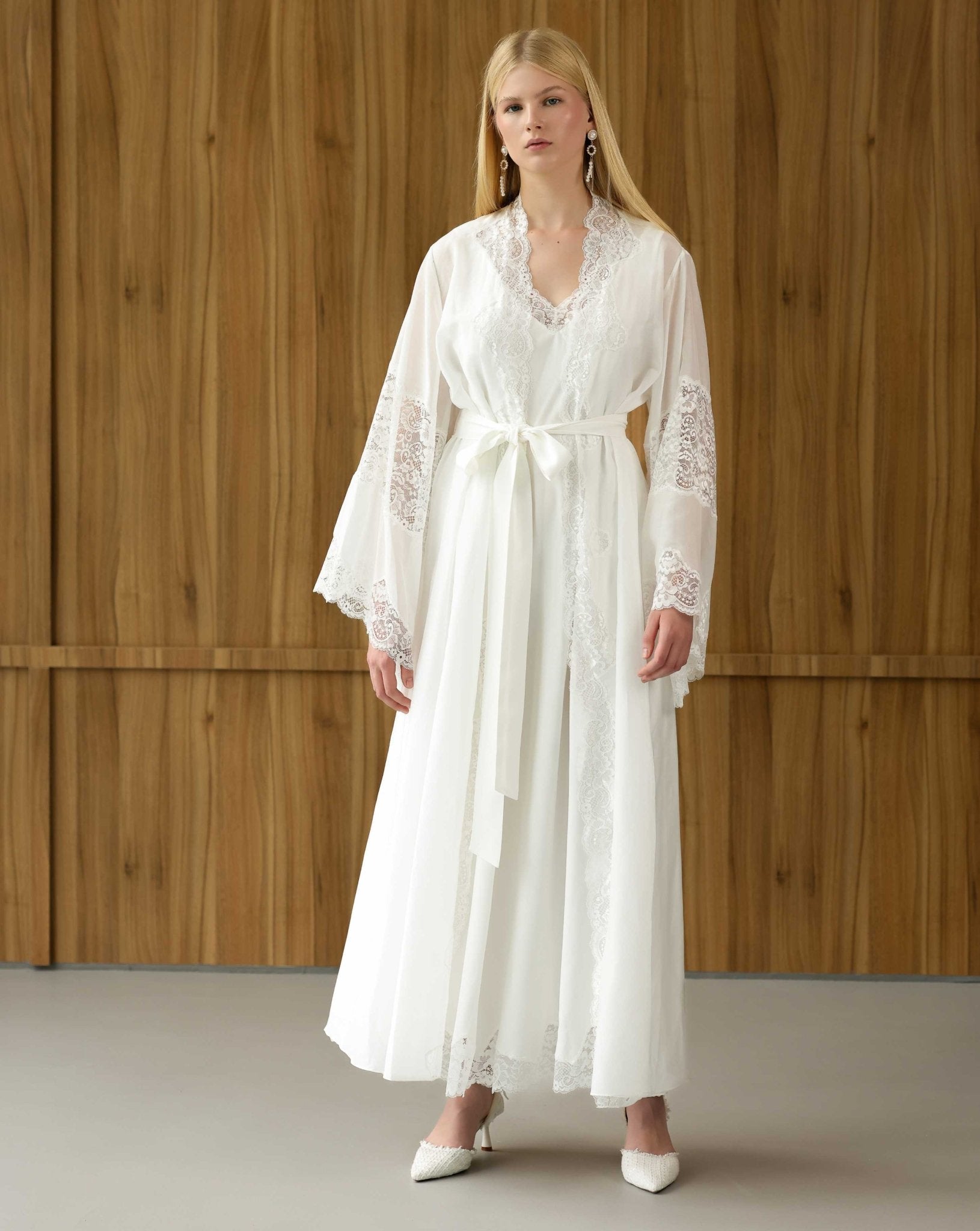 White maternity robe and gown in motion, showing the airy, flowing silhouette of the lightweight natural fabric.