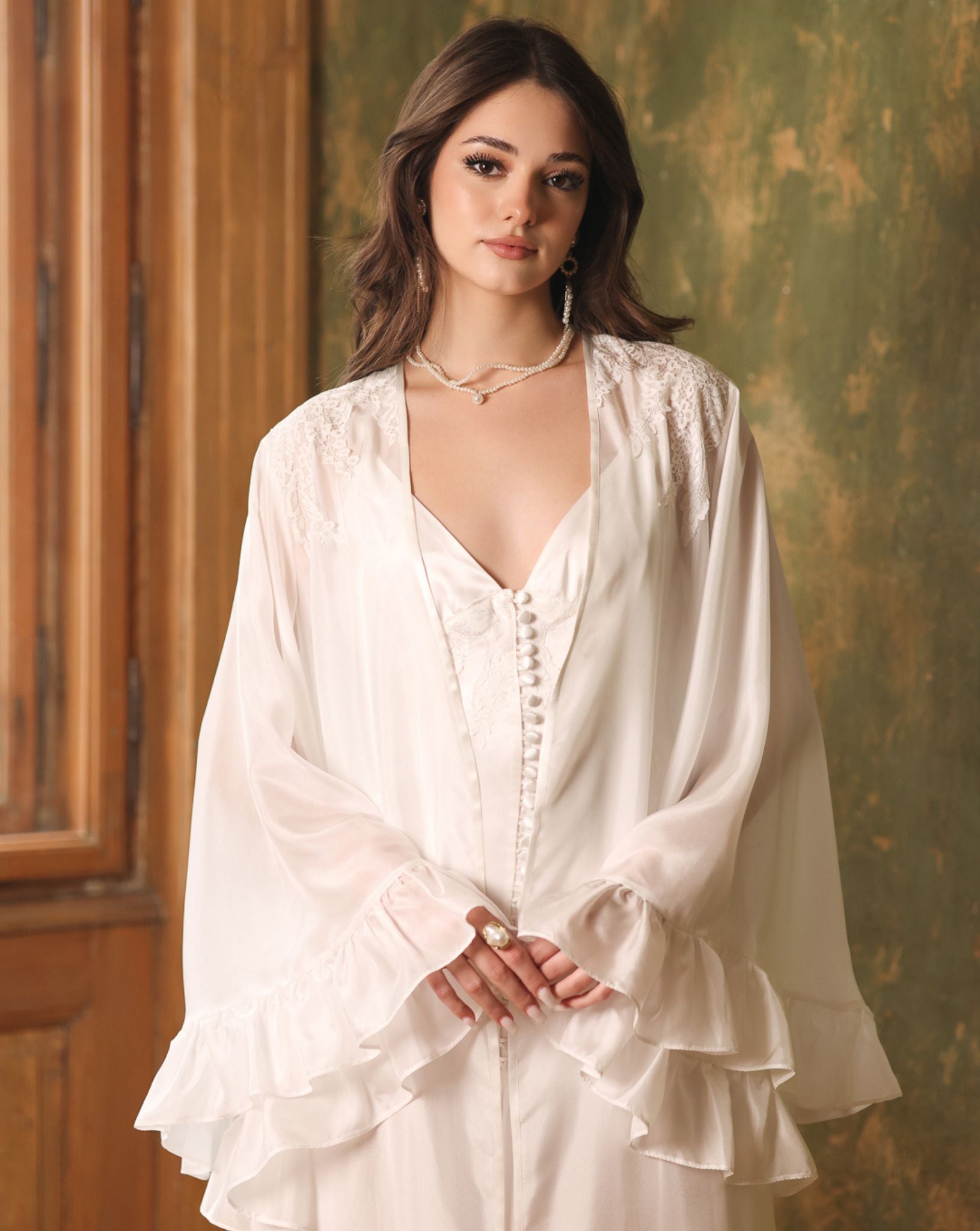 Portrait-length shot highlighting the flattering neckline and the soft romantic feel of the silk ensemble.