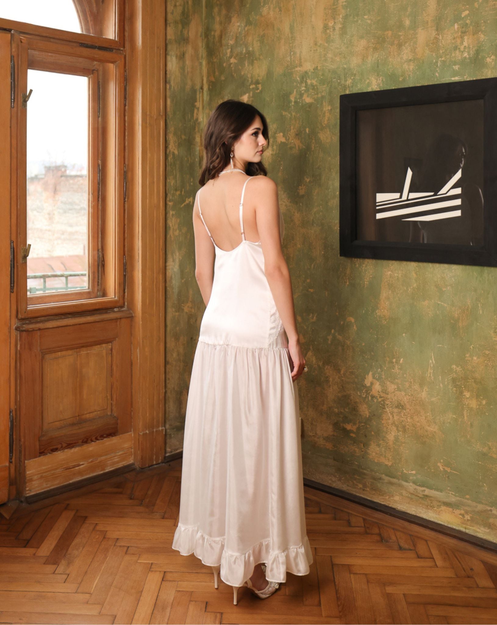 Rear view of the silk satin nightdress, highlighting the elegant princess style cut and the smooth, glossy texture.