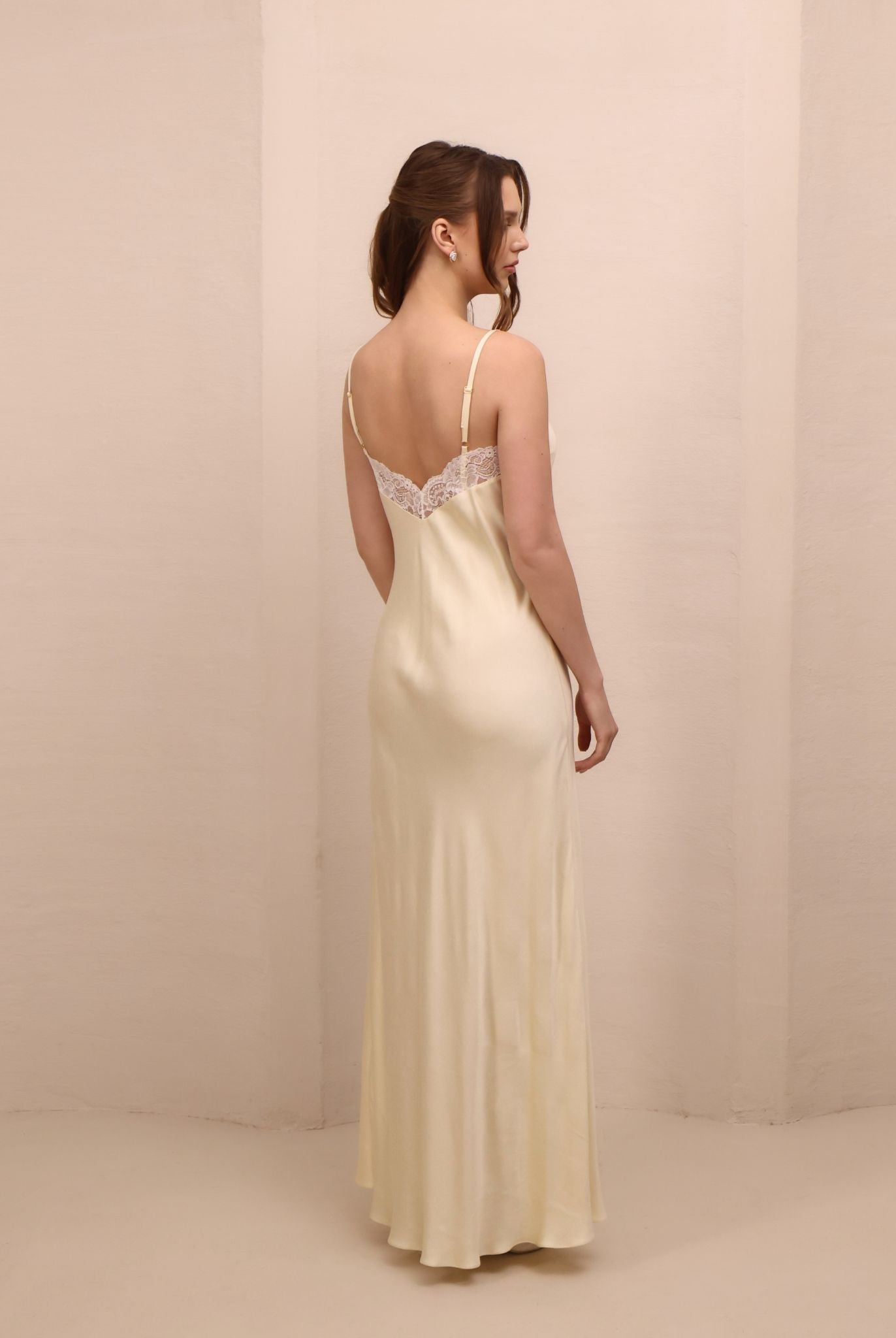 Rear view of the nightgown, highlighting the mid-open V-cut back and the soft, flattering fit that skims the body.