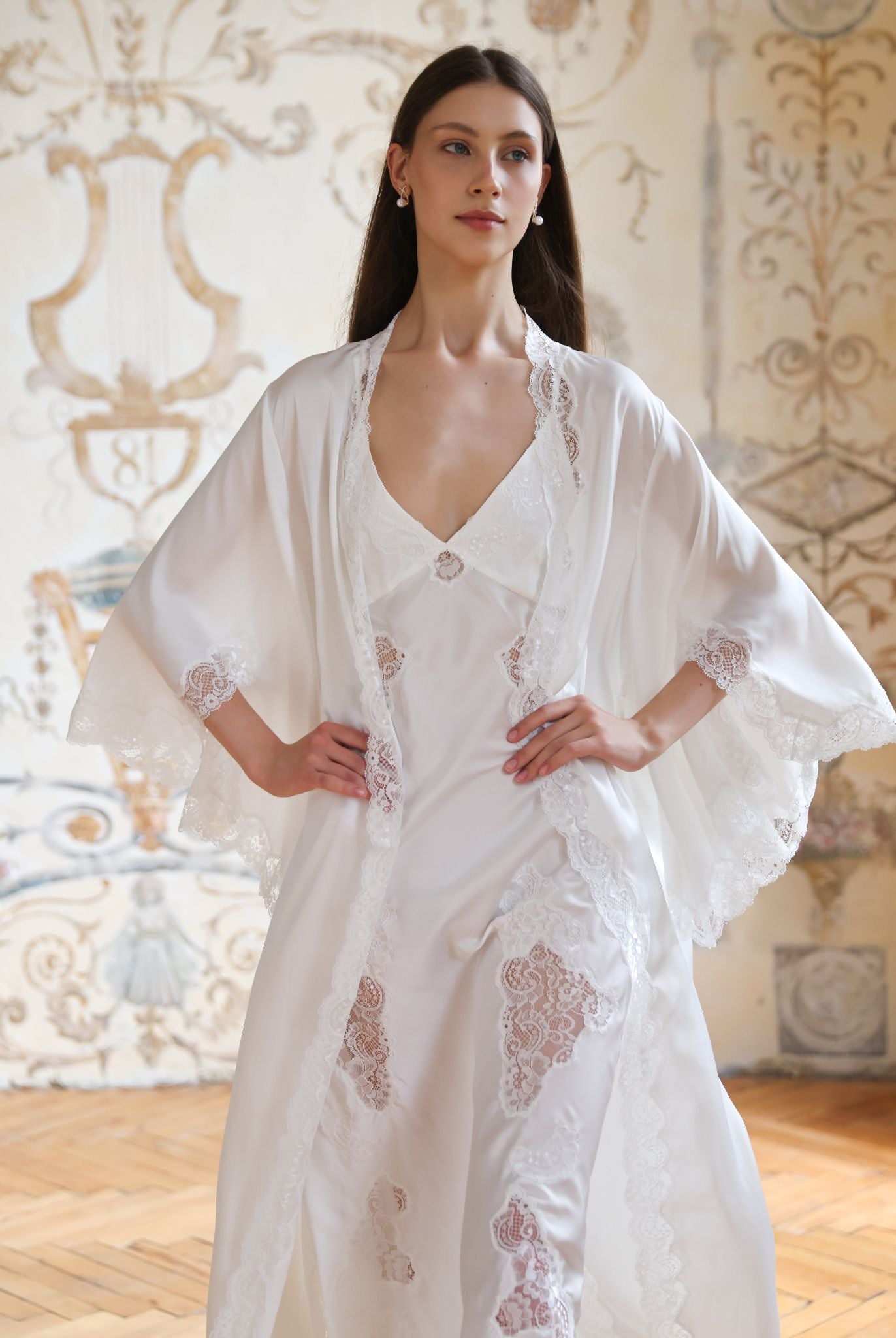 Mid-length static view of the Blossom ensemble, highlighting the elegant wrap-over robe with hands placed on the waist.