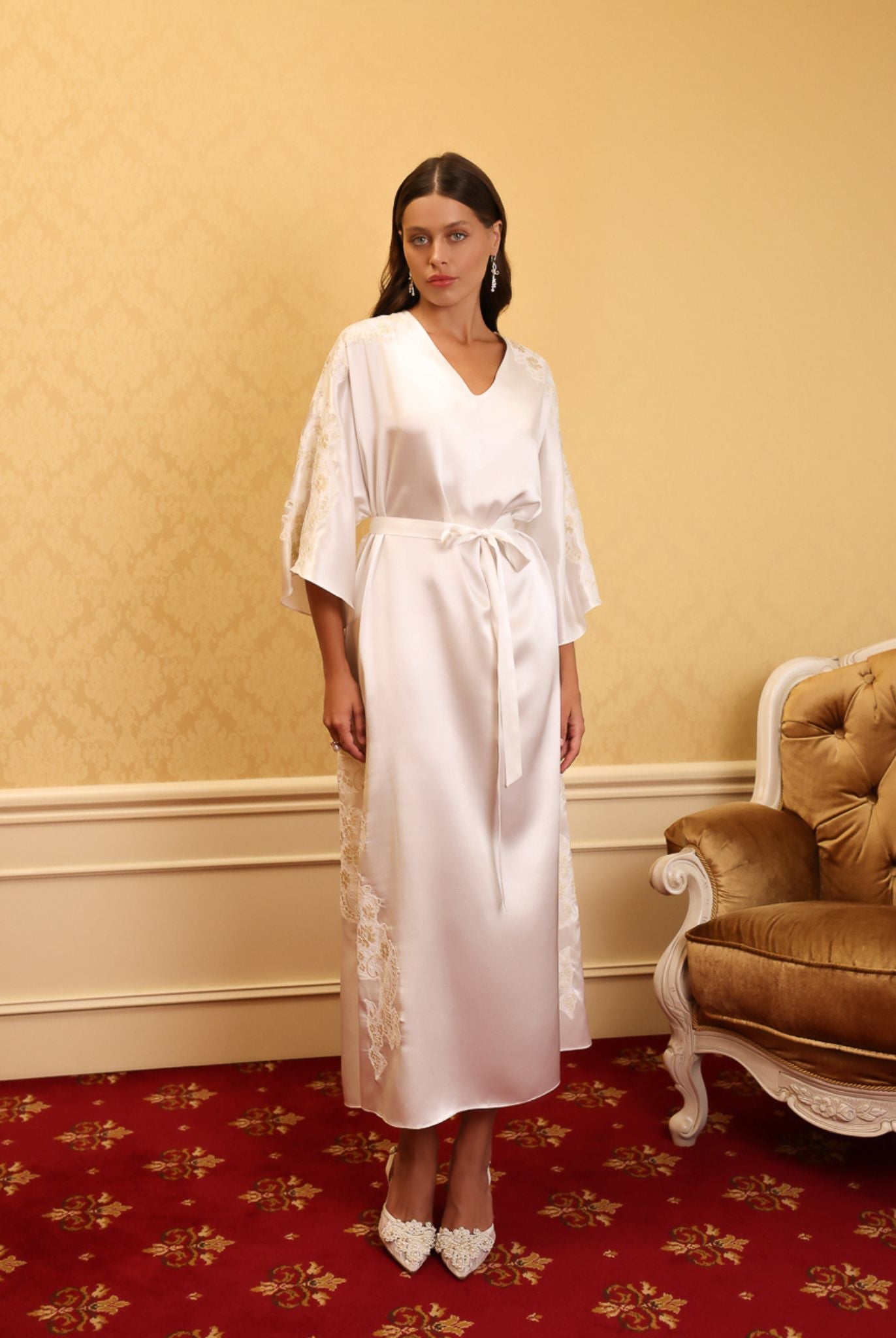 Full-length shot of model wearing embroidered white kaftan in gold interior – KÂfemme