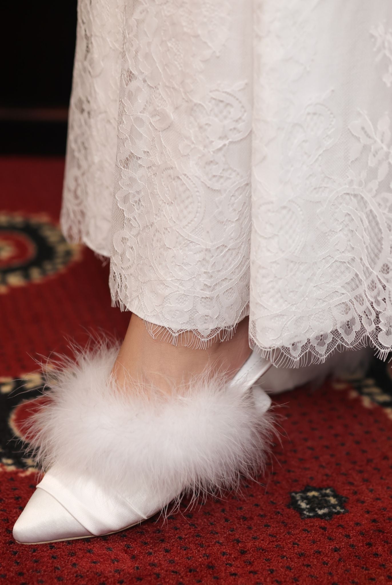 Detailed macro shot highlighting the intricate lace textures and the heirloom feel of the premium material.