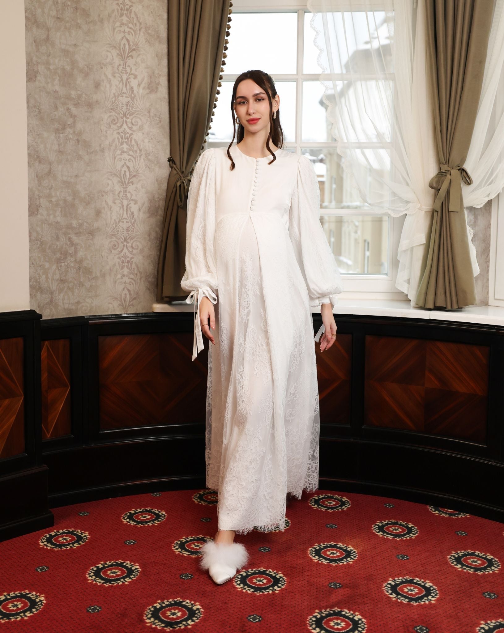 A full-length shot of the Modest Lounge Dress in motion, illustrating the grace of the layered lace skirt.