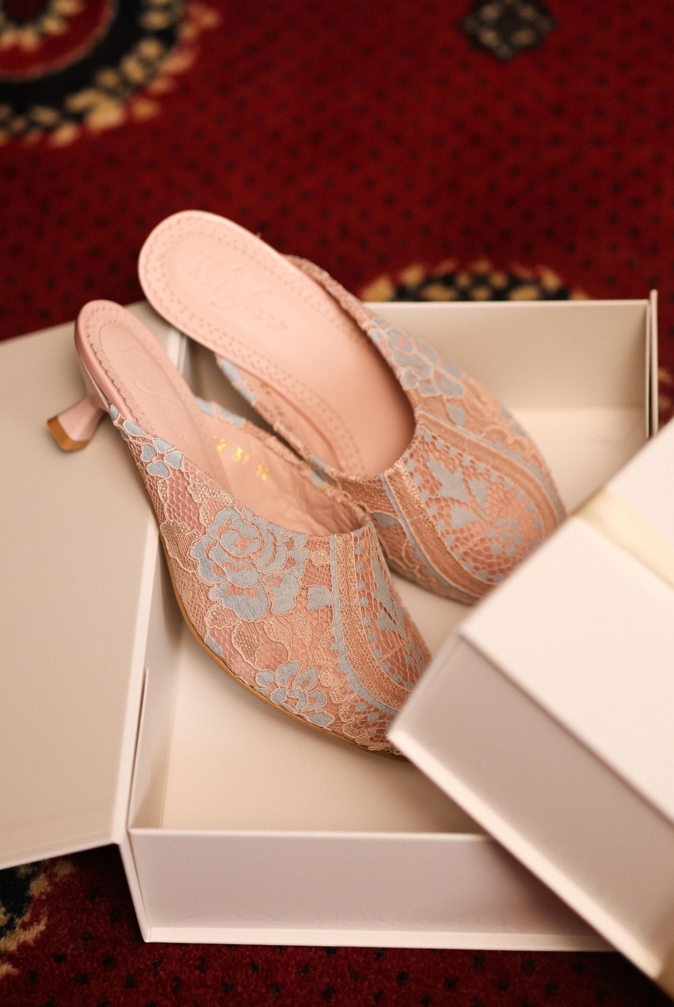 Elegant footwear presented inside its branded box, showcasing a refined essential for a private collection.