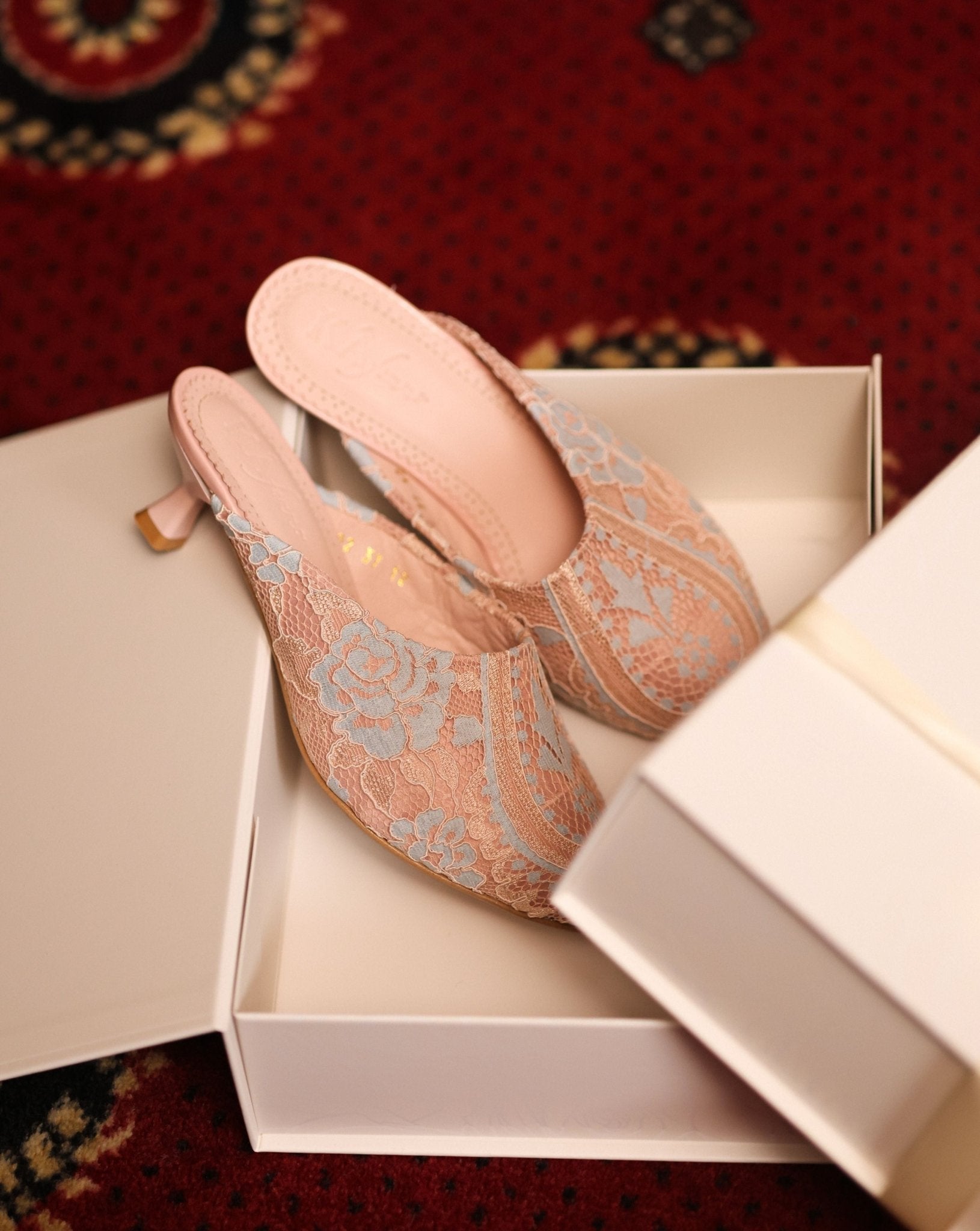 Elegant footwear presented inside its branded box, showcasing a refined essential for a private collection.