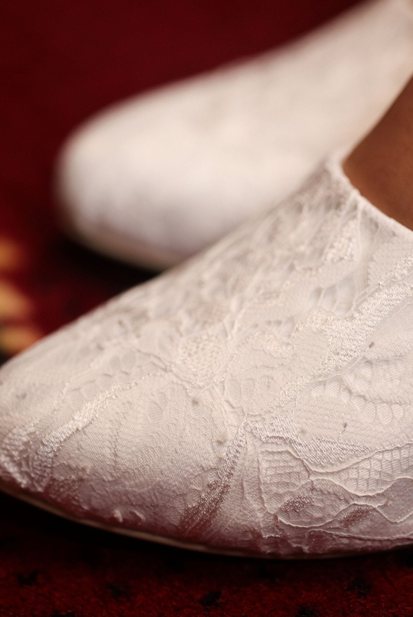 Detailed view of the rounded toe area adorned with delicate lace detailing for a classic, timeless silhouette.
