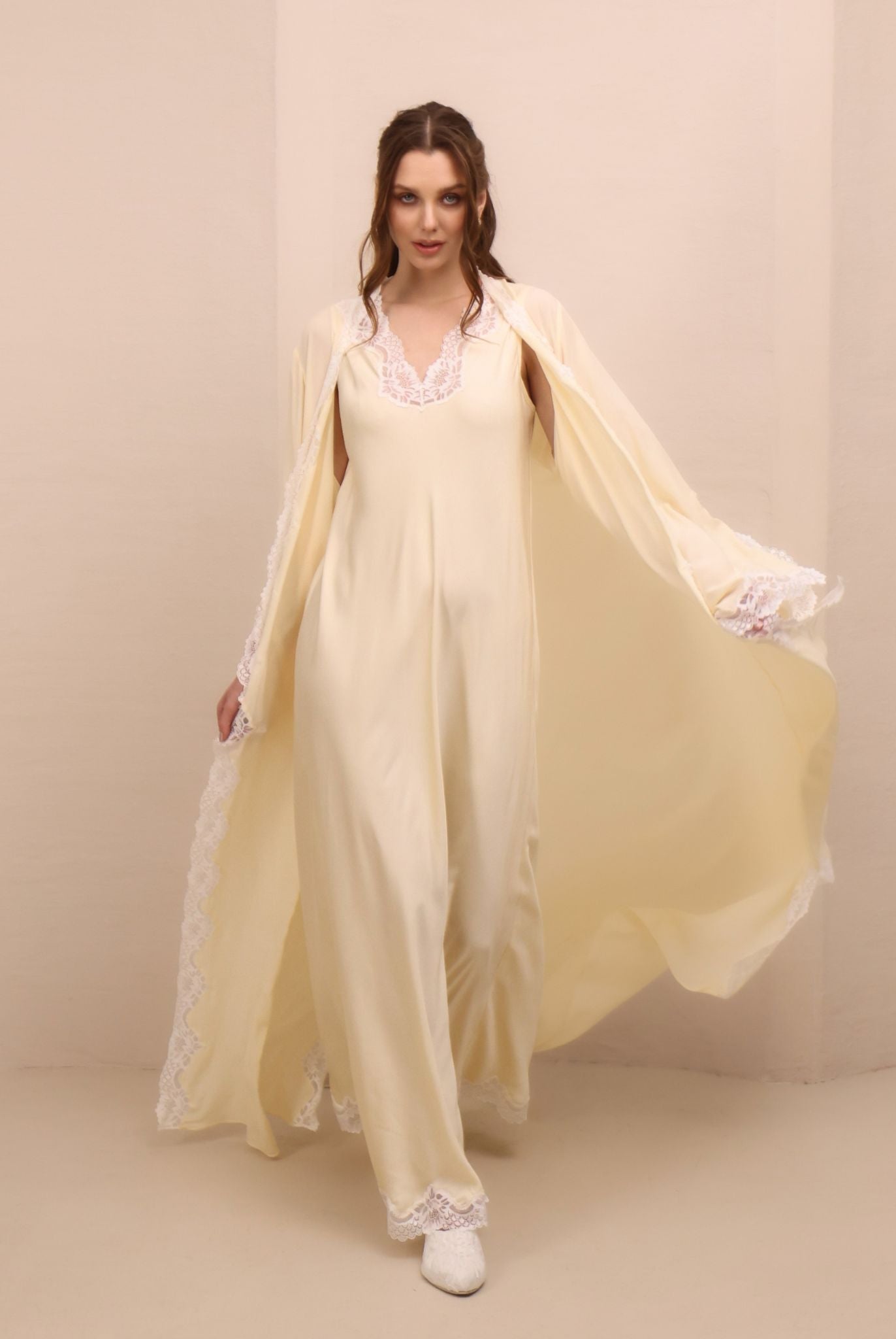 A dynamic motion shot of the Robe and Nightgown Set, capturing the fluid rayon and elegant side slits.