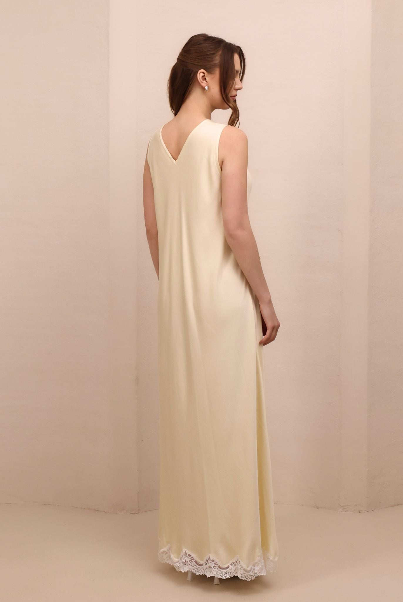 Rear view of the nightdress featuring a short open V-cut back for a touch of timeless sophistication and allure.