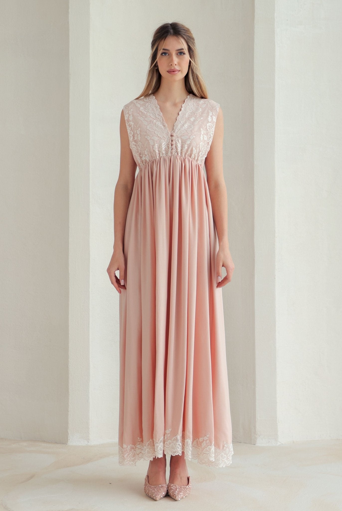 Front view of the nightgown featuring a floral lace bodice with small, reachable buttons for easy and quick nursing.