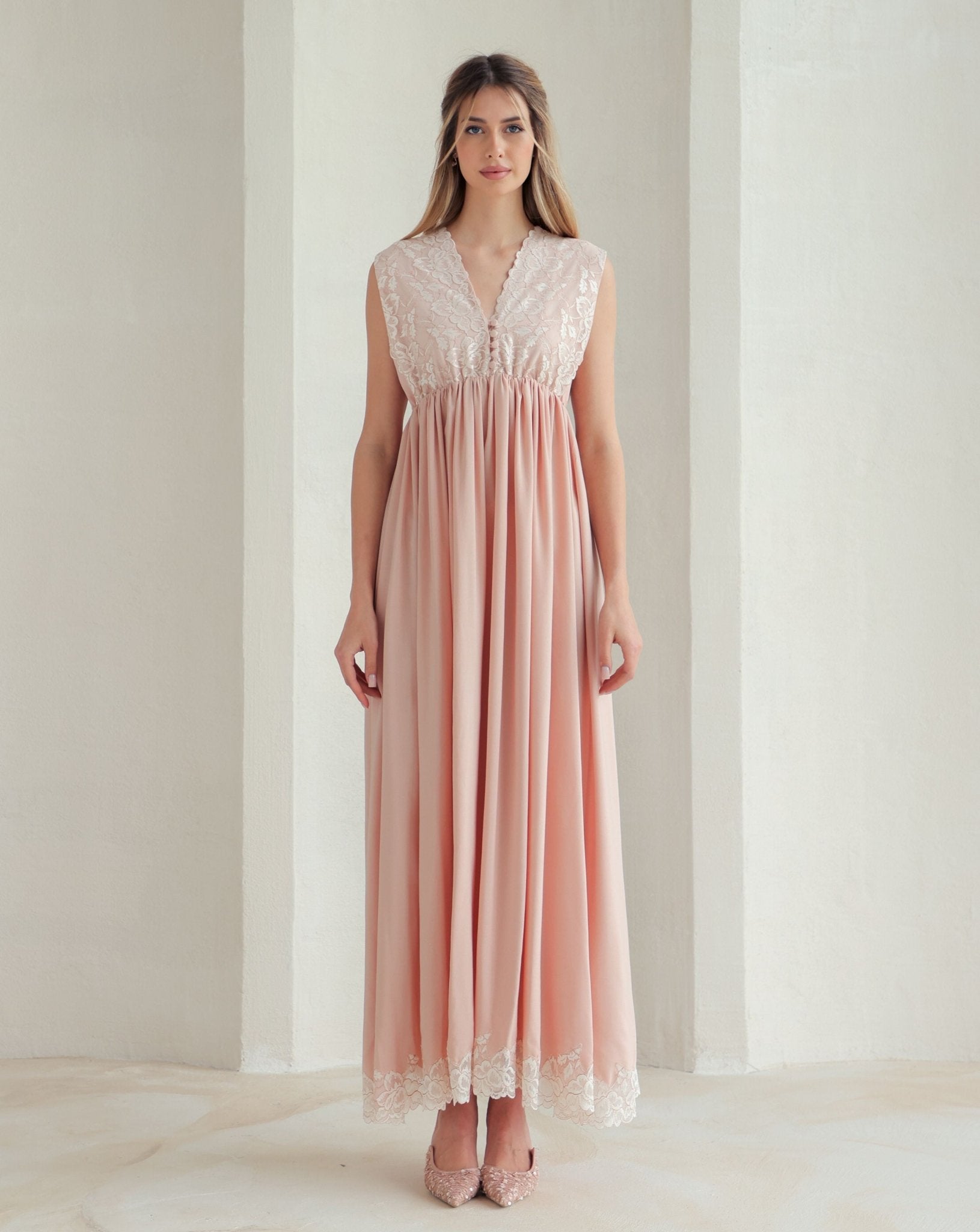 Front view of the nightgown featuring a floral lace bodice with small, reachable buttons for easy and quick nursing.