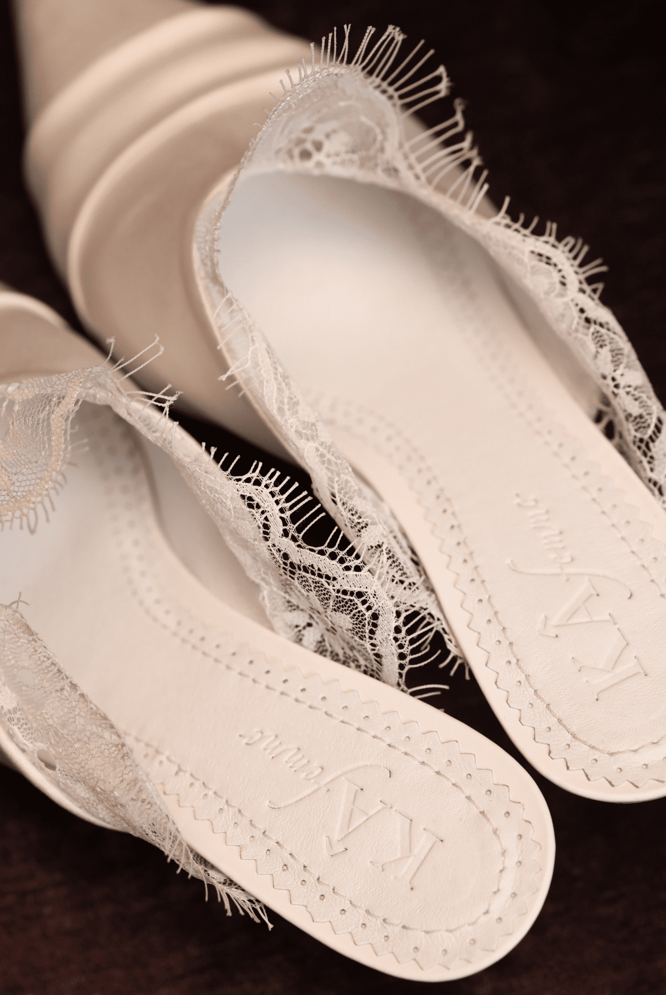 A clear view of the genuine leather insole featuring the brand logo and soft padding for long-wearing comfort.