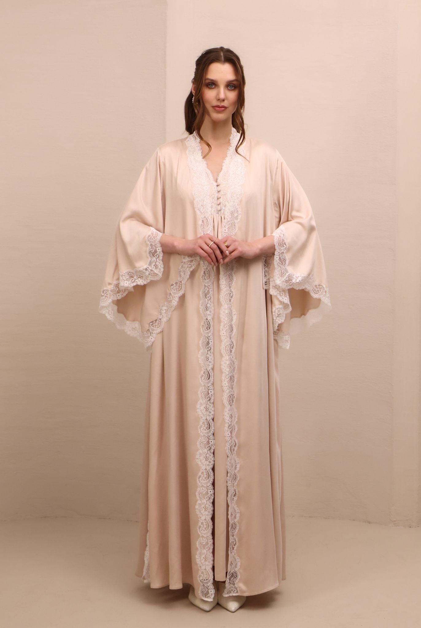 A poised frontal view of the ensemble, designed to offer comfort and serene beauty for expectant mothers.