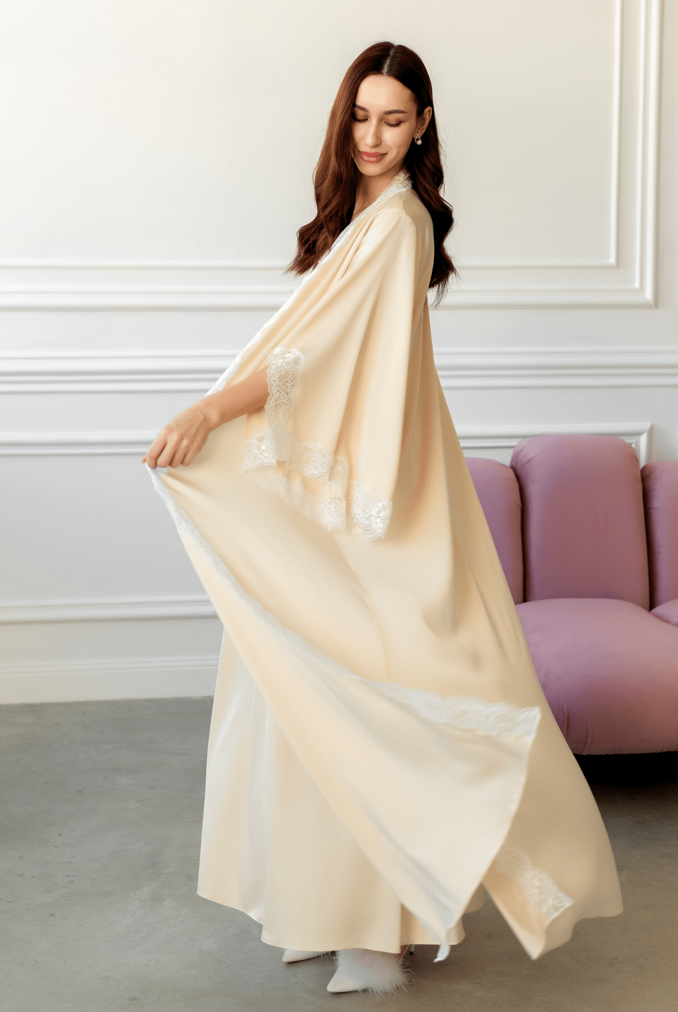 Vanilla Maternity Robe and Nightgown Set in motion, showing the elegant flowing fabric and soft lace trim.