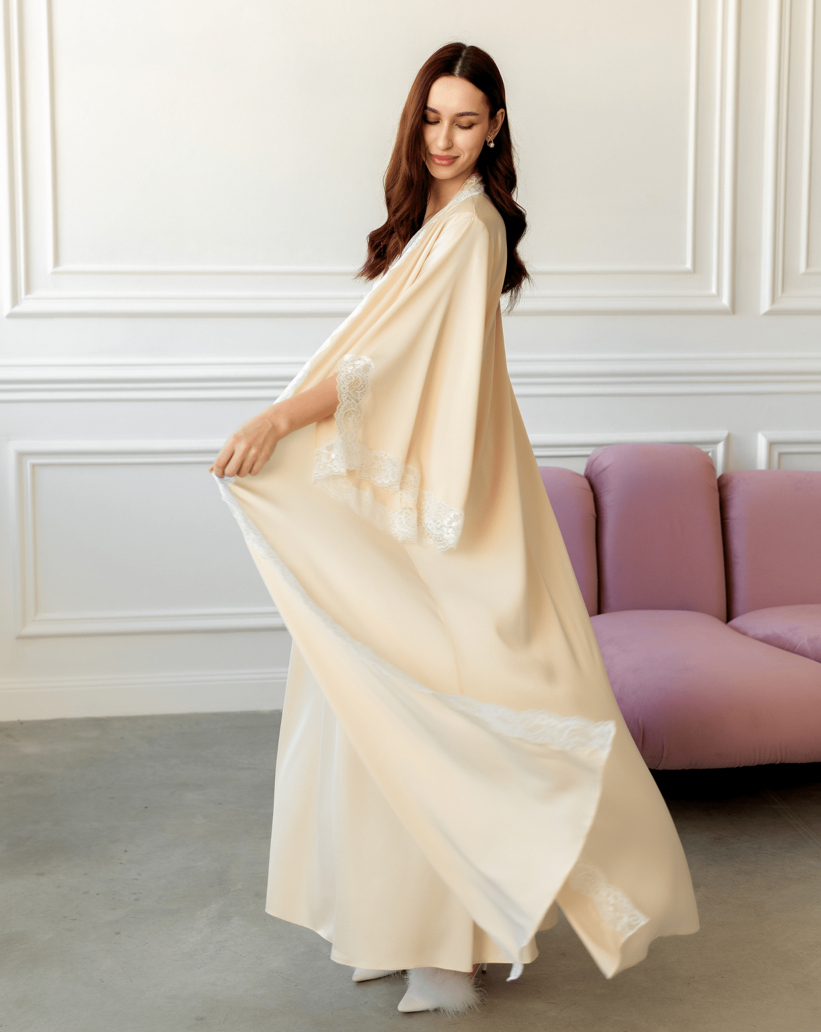 Vanilla Maternity Robe and Nightgown Set in motion, showing the elegant flowing fabric and soft lace trim.