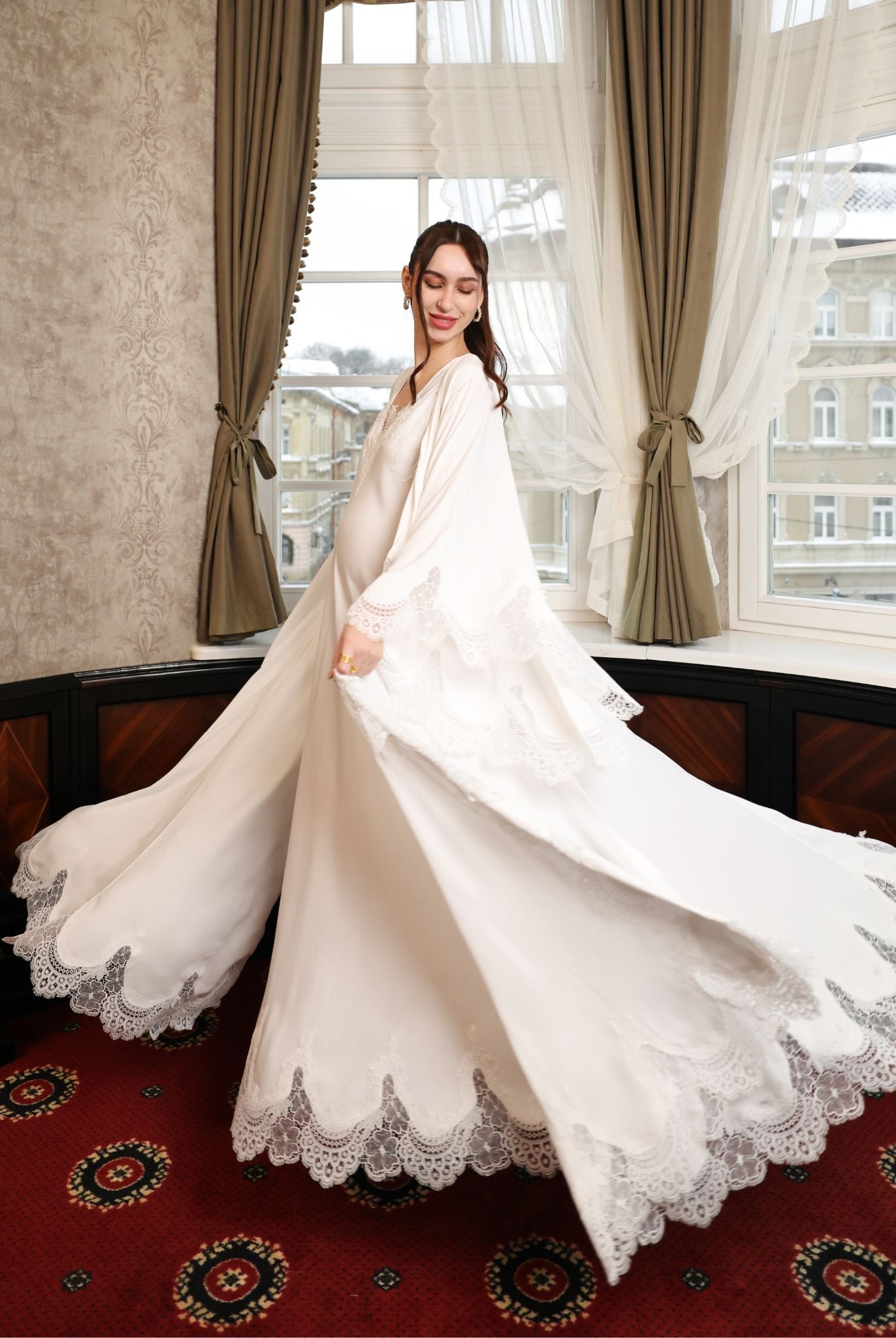 A dynamic action shot showcasing the sweeping movement of the lace-trimmed hem during a graceful turn.