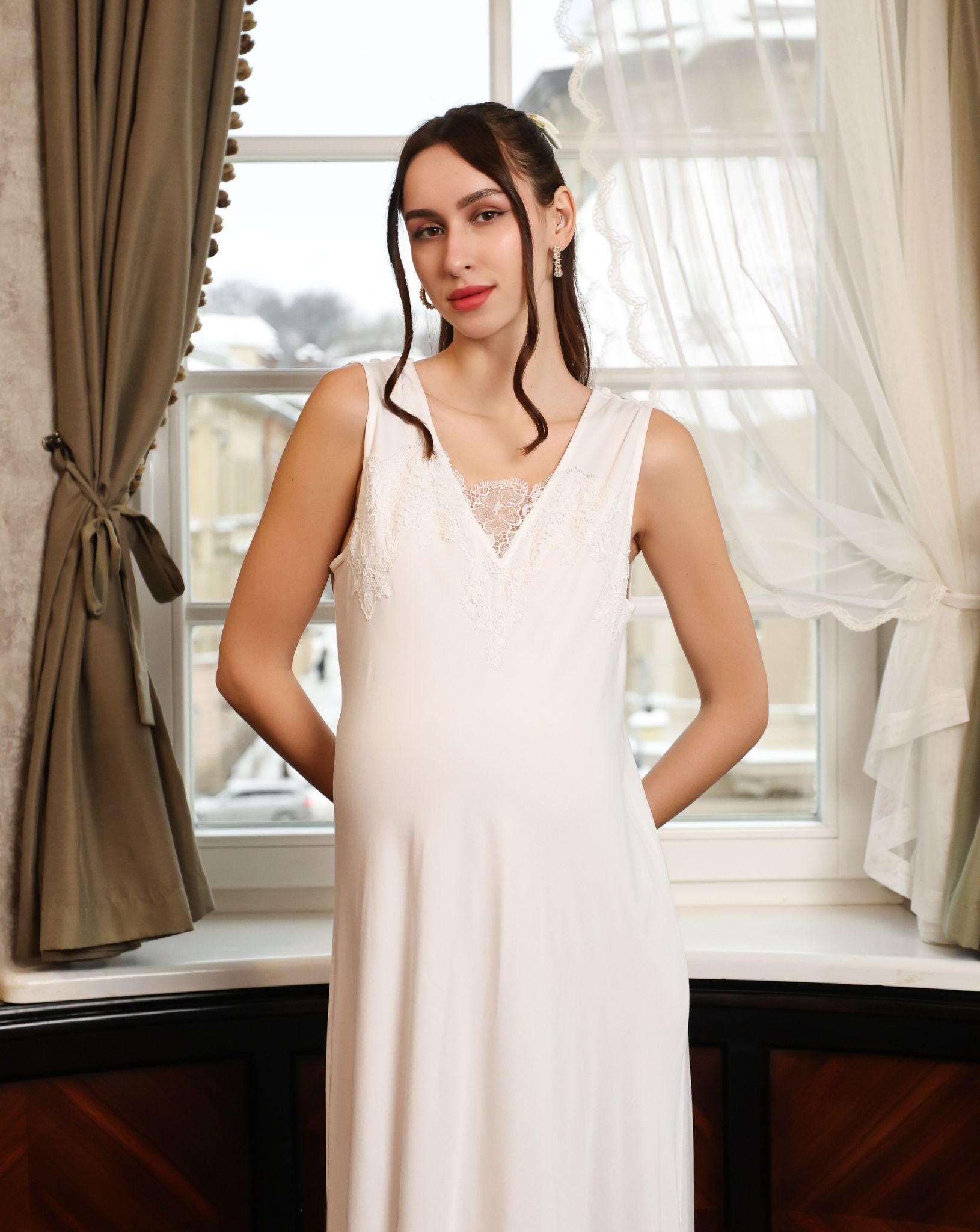 Mid-length view of the nightgown, emphasizing its sleeveless silhouette and timeless romantic charm.