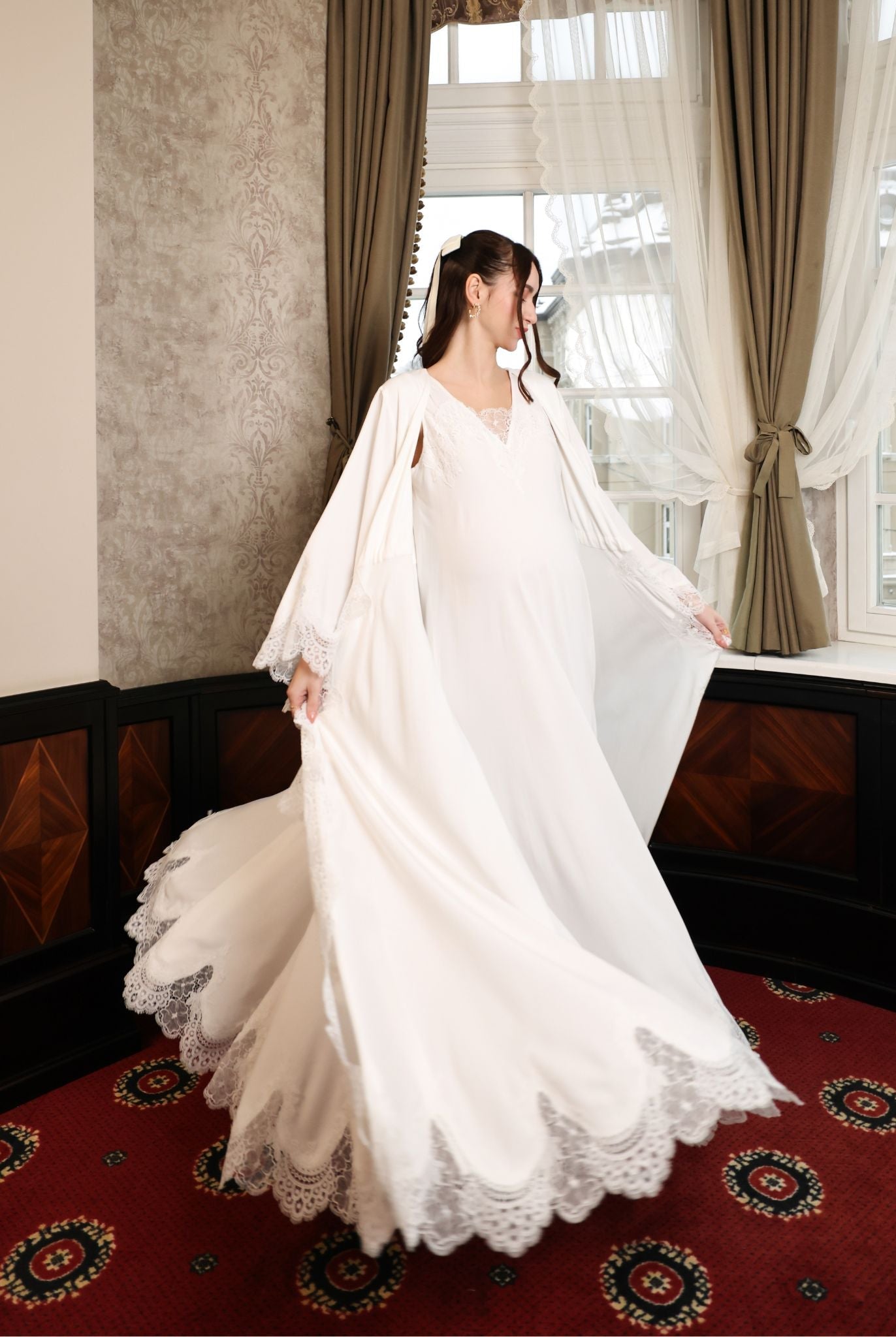 A side perspective of the ensemble during a turn, showcasing how the widened bottom of the robe gracefully moves.