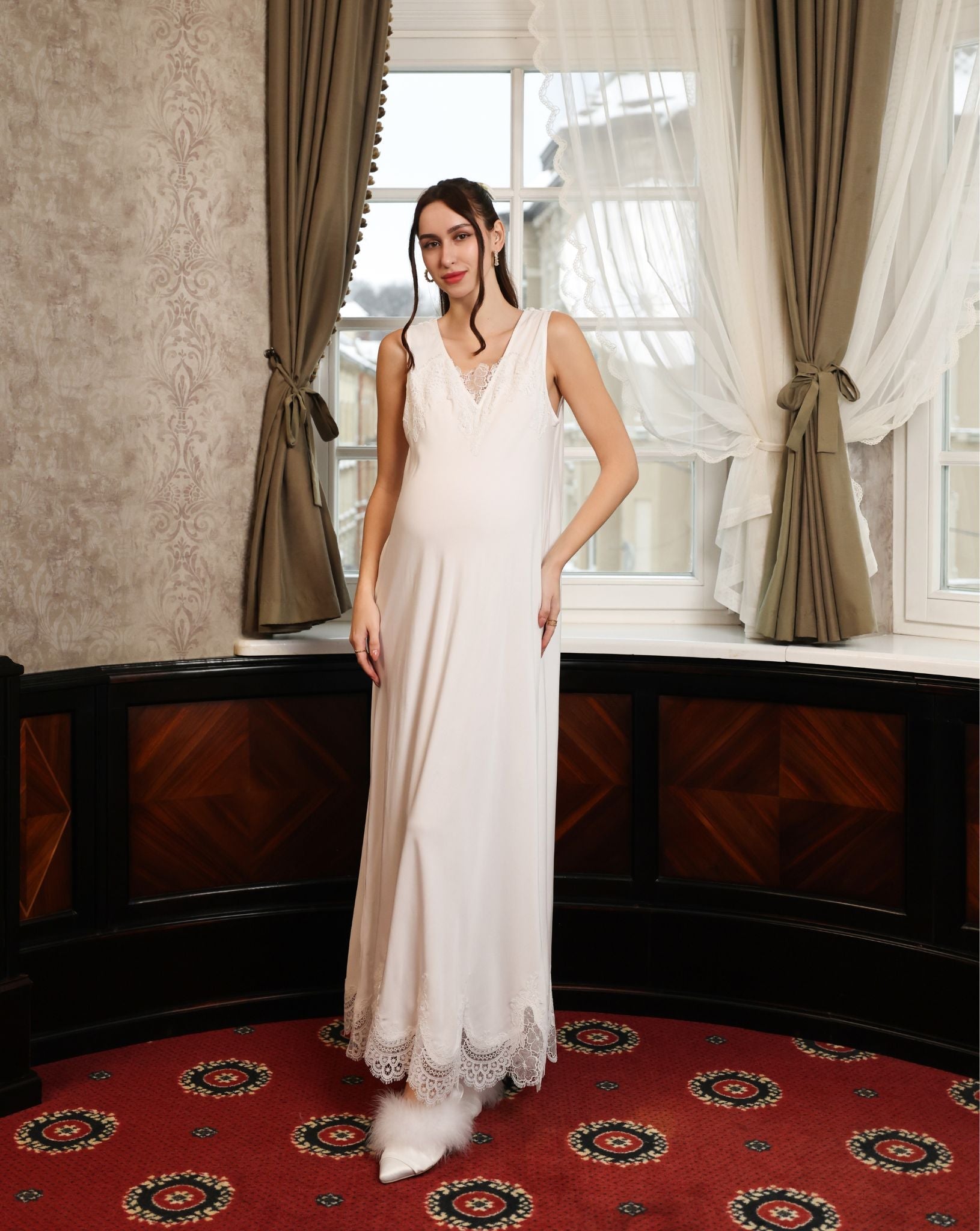 Frontal view of the sleeveless nightgown, featuring delicate lace along the neckline for a romantic finish.