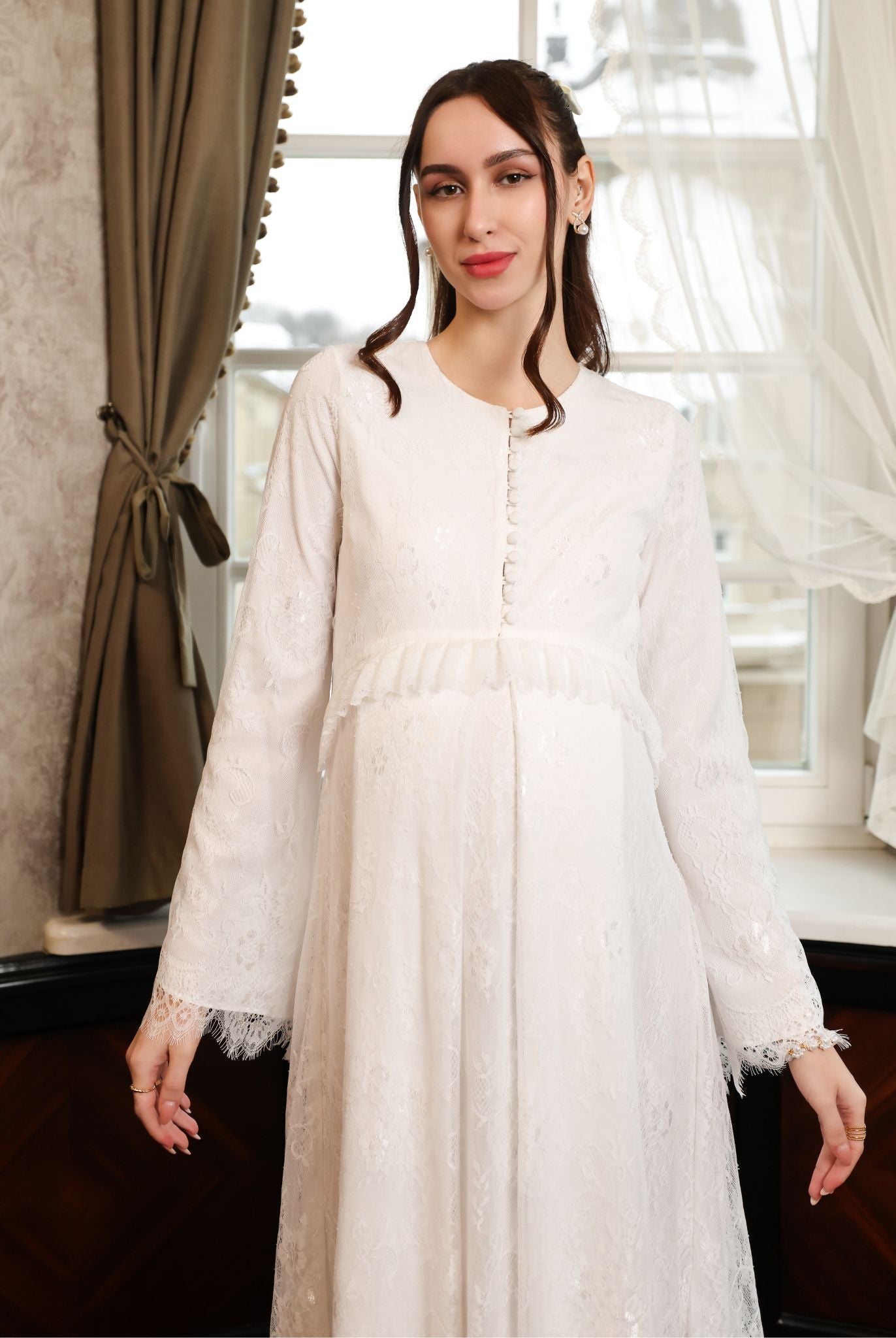 A mid-length view with hands down, emphasizing the modest cut and the seamless lace coverage across the silhouette.