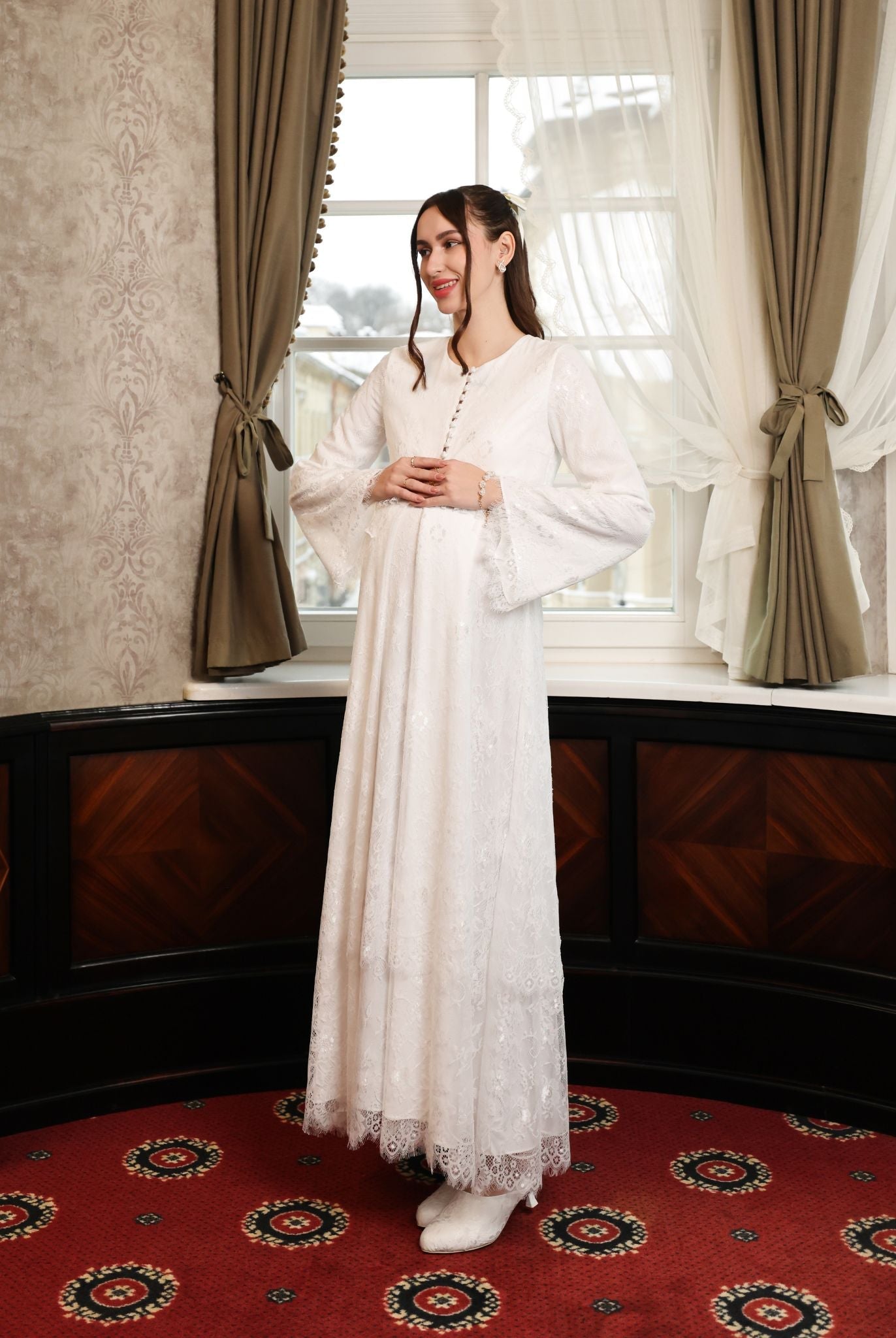A dynamic side view of the Modest Lounge Dress, highlighting the flattering maternity fit and soft lace movement.